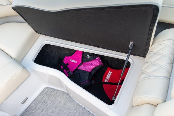 Manufacturer Provided Image: 2026 Regal LS6 boat storage compartment with life jackets inside.