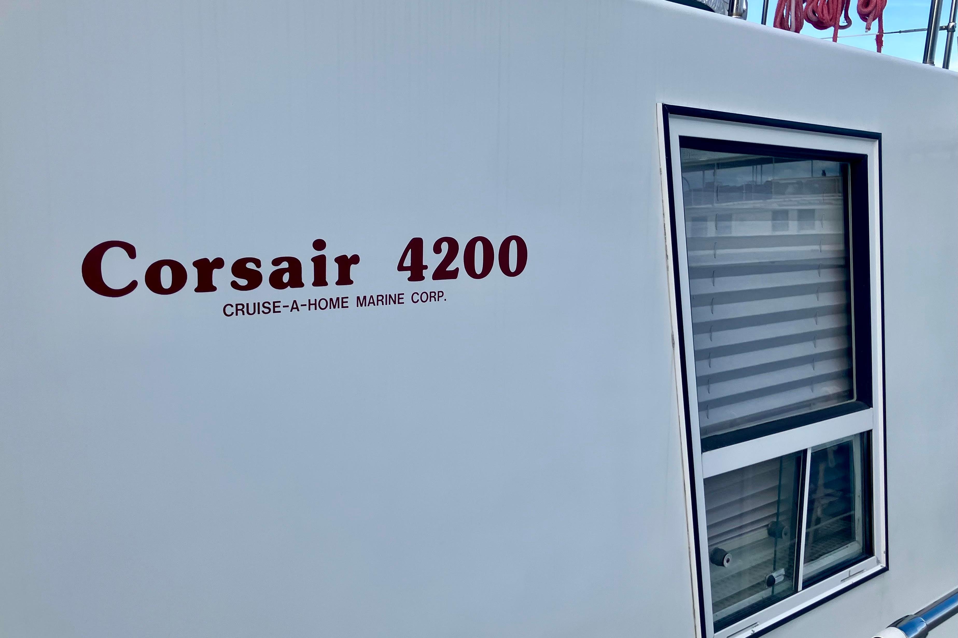Side view of a 1992 Cruise-A-Home Corsair 4200 with window and logo.