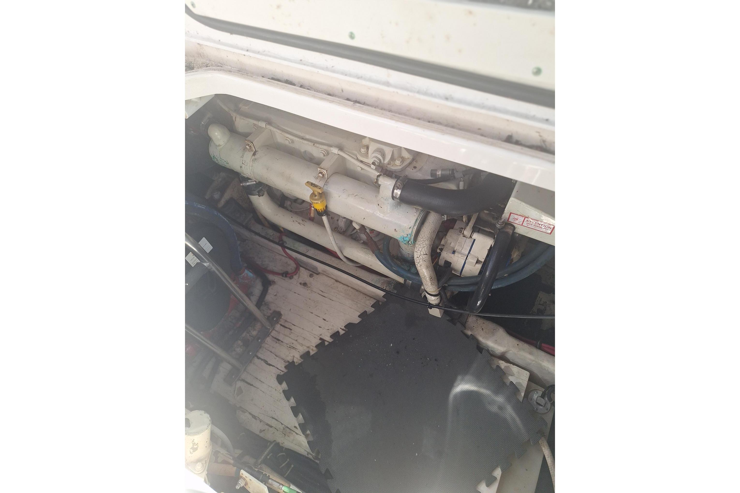 Engine compartment of a 2002 Tiara Yachts 3500 Open, showing mechanical components.