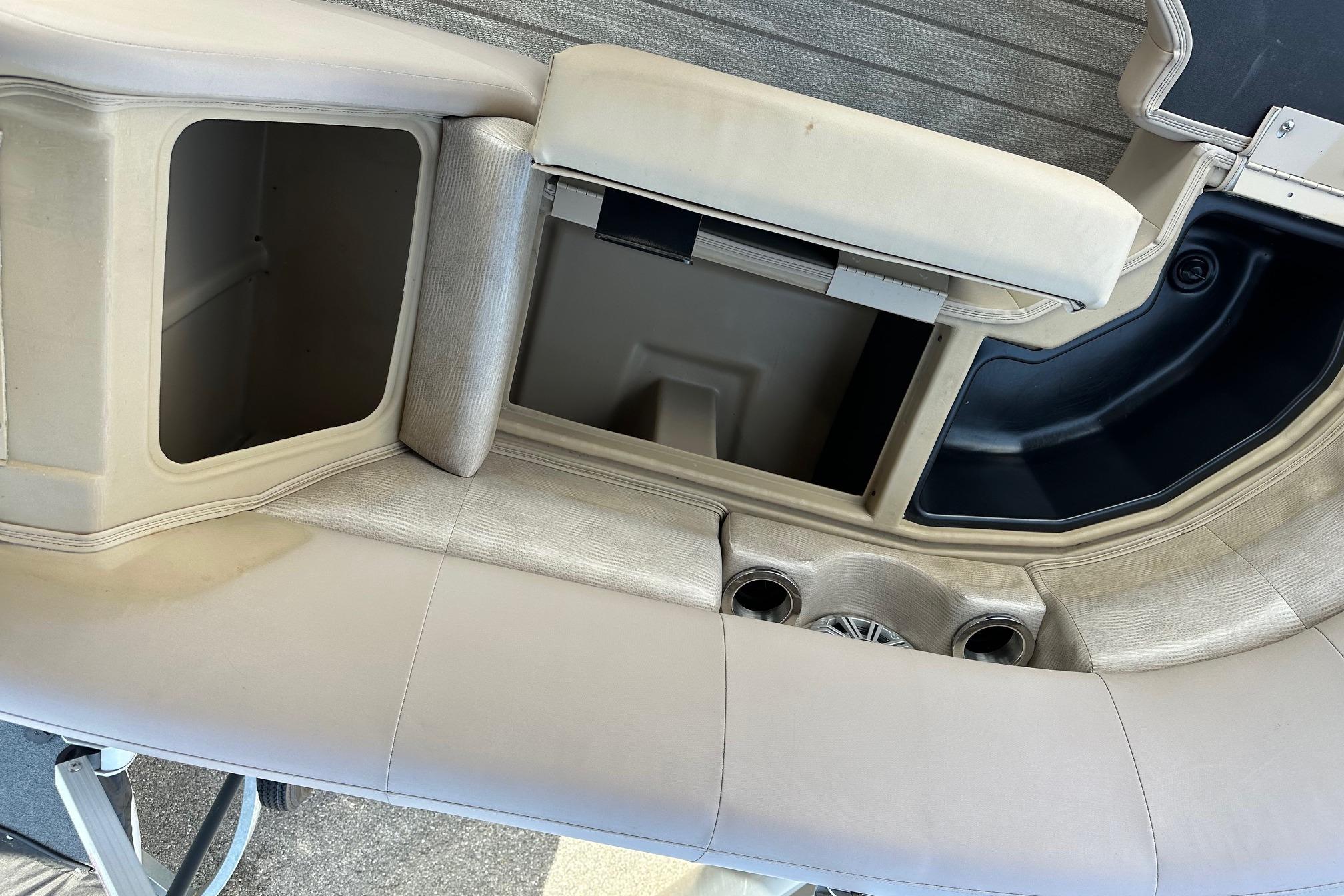 Interior seating and storage of a 2017 Bennington 22 GPD pontoon boat.