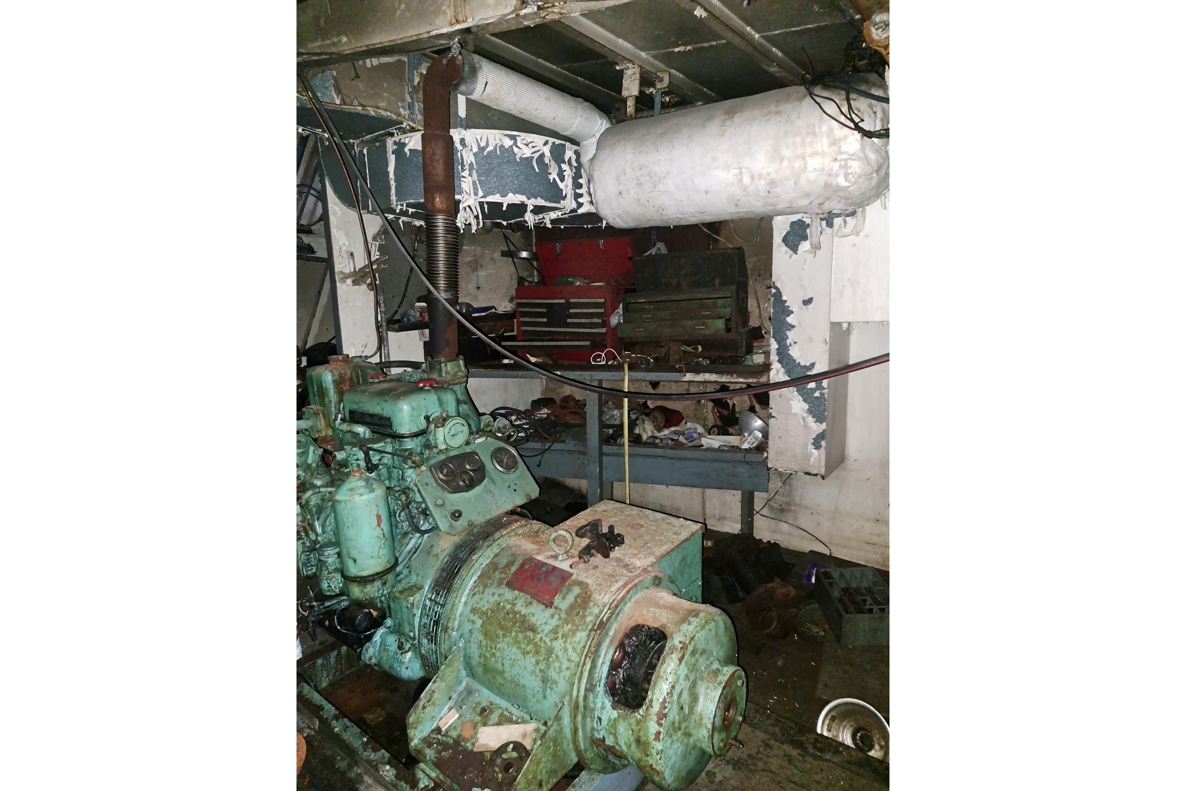 Engine room of a 1979 Custom Steel Trawler Dragger with visible machinery and equipment.