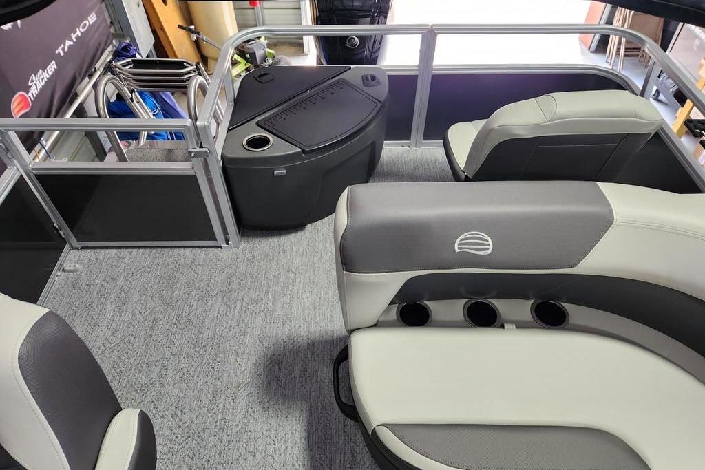 2026 Sun Tracker Bass Buggy 18 DLX interior with seating and storage compartments.