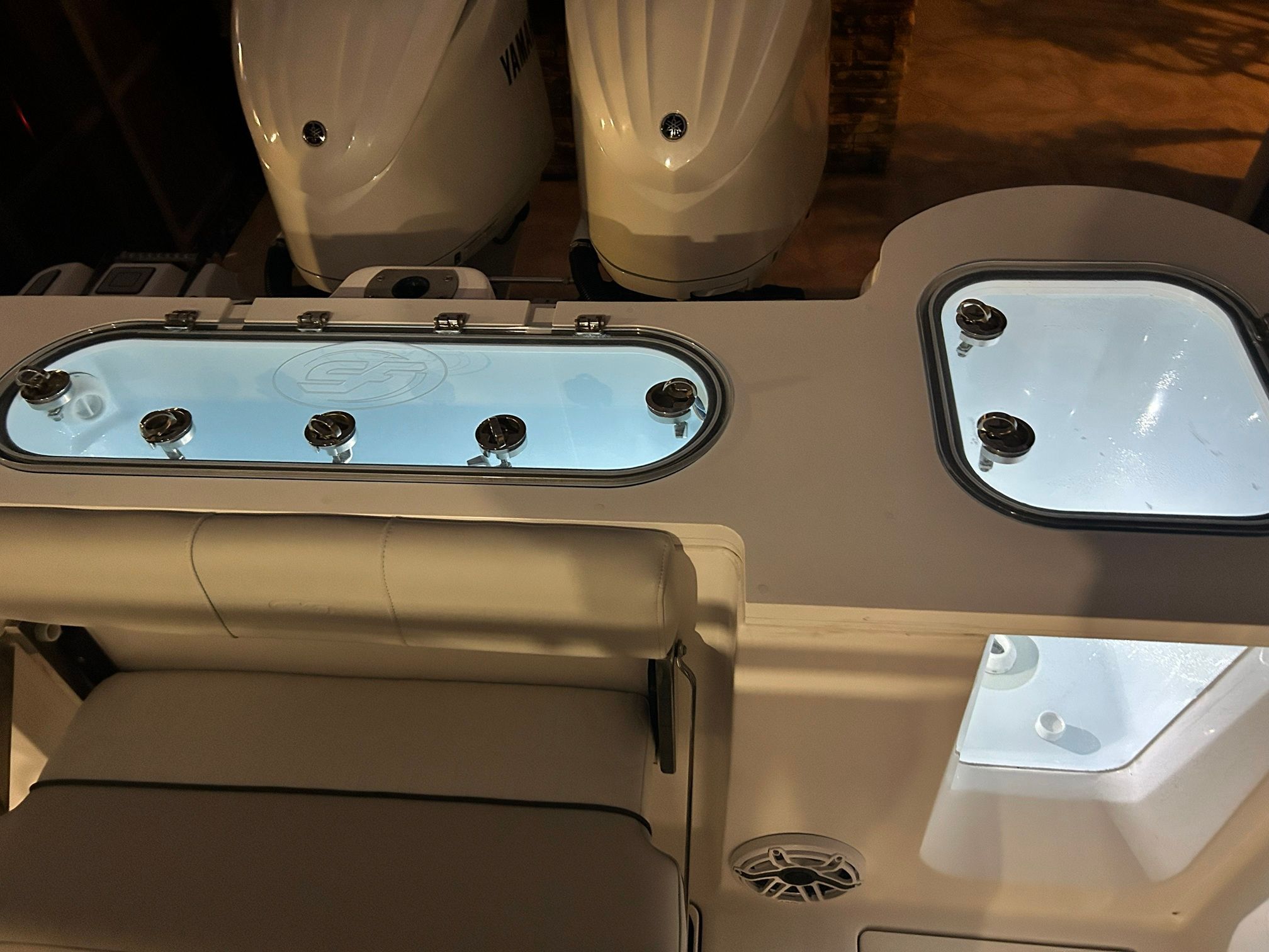 The image shows the illuminated stern area of a Sea Fox 288 Commander with engines.