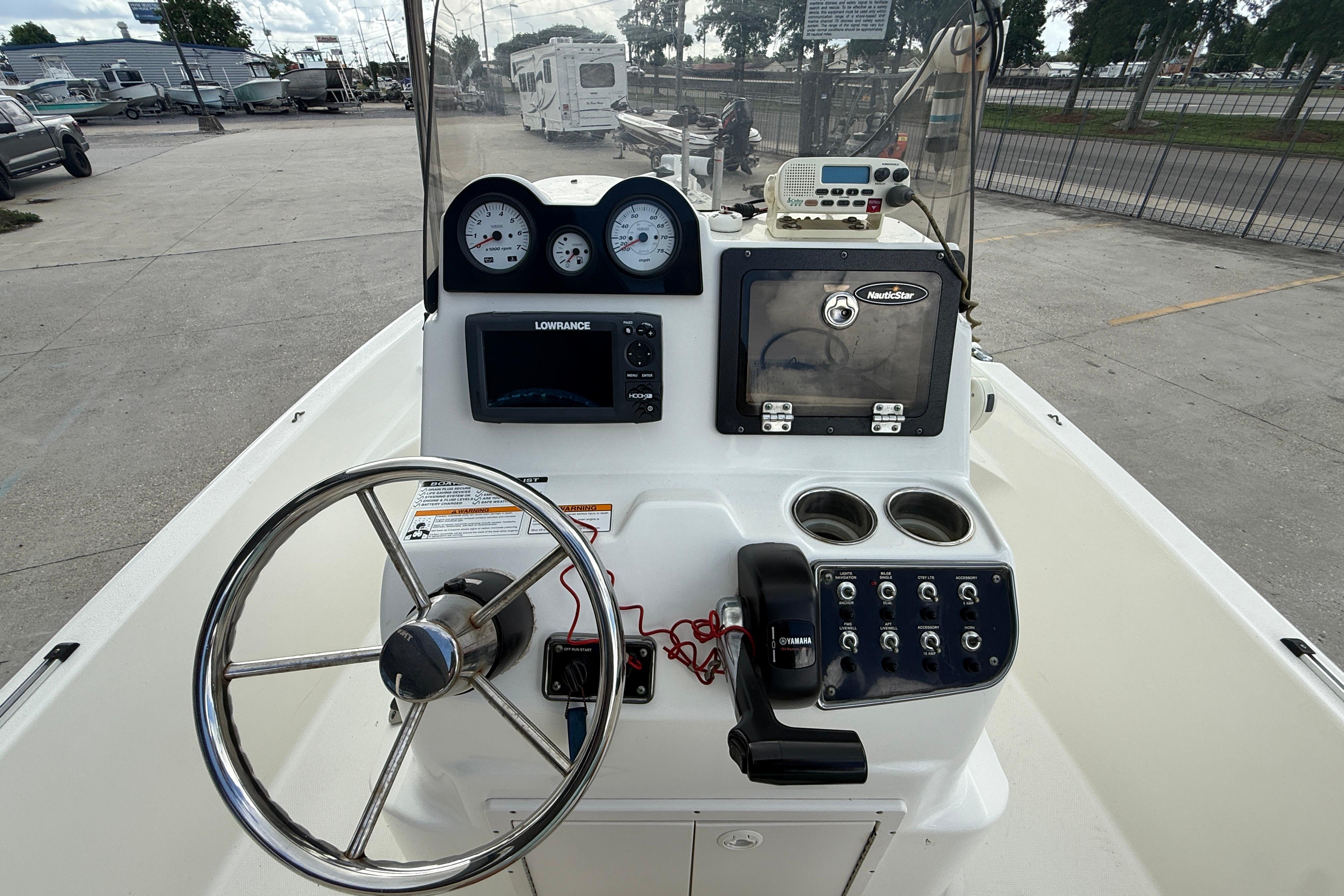 2017 NauticStar 1910 NauticBay boat console with steering wheel and navigation equipment.
