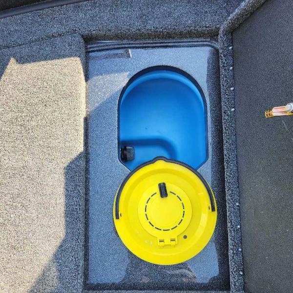 2024 Nitro ZV20 Pro boat storage compartment with blue and yellow lids.