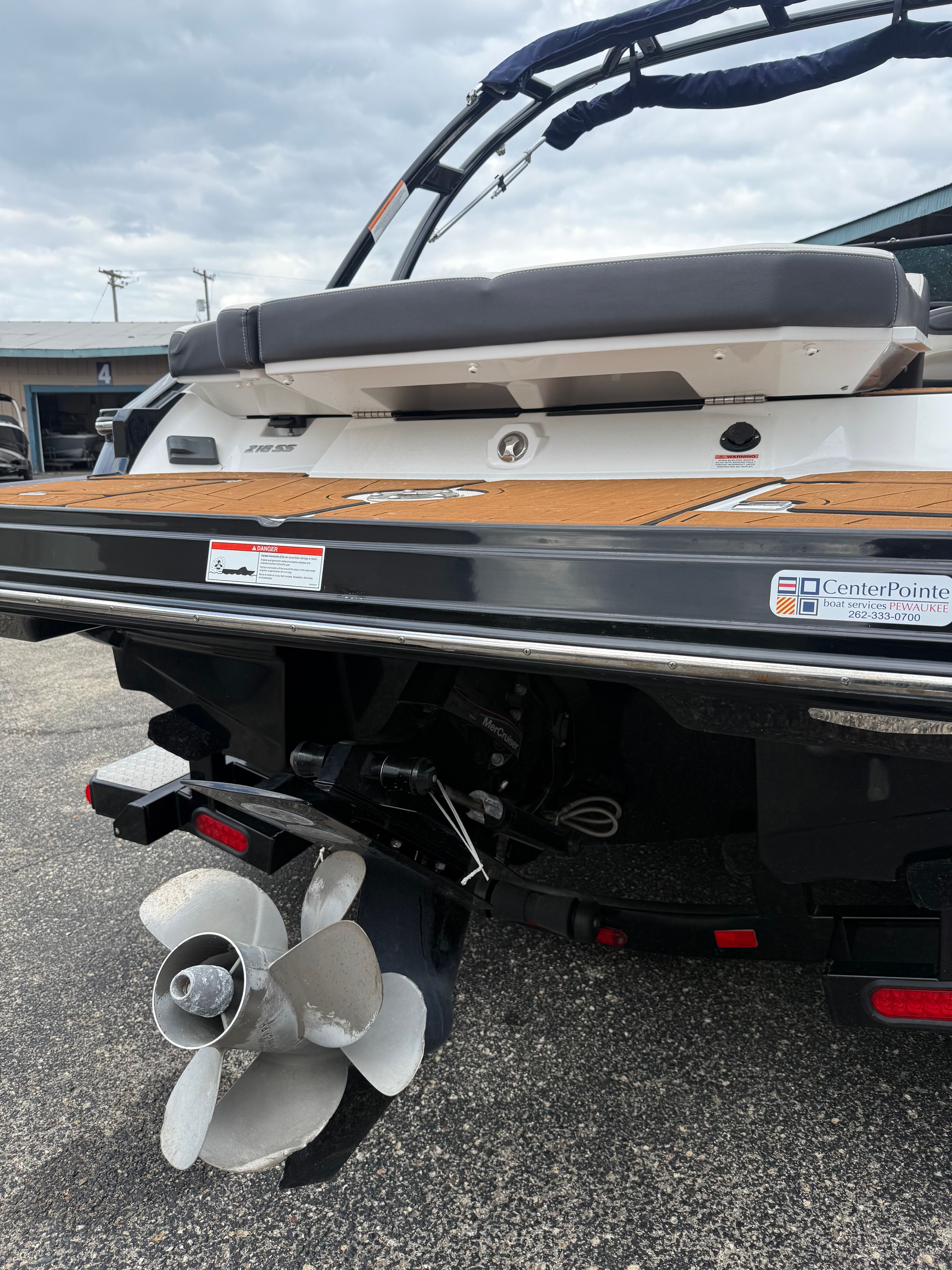 Rear view of a 2021 Monterey 218 Super Sport boat with propeller.
