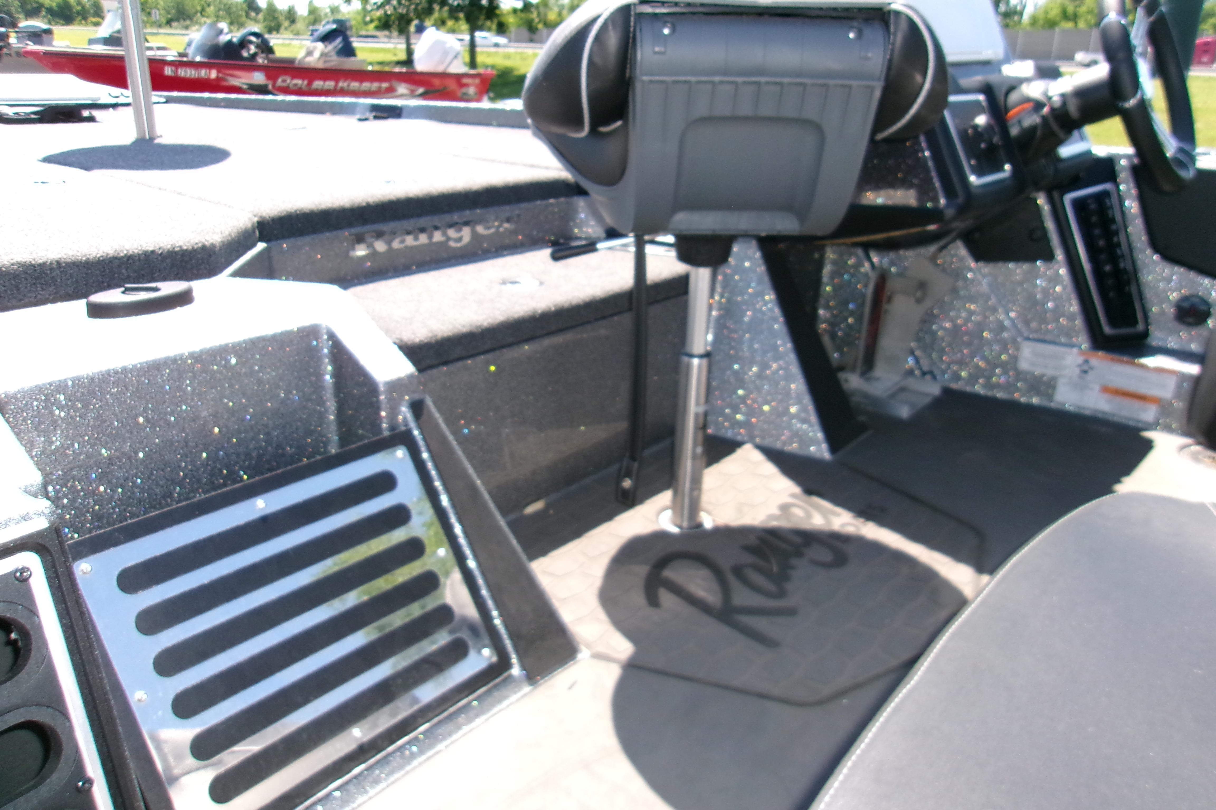 Interior of 2025 Ranger Z519R Cup-Equipped boat, featuring sleek seating and control panel.