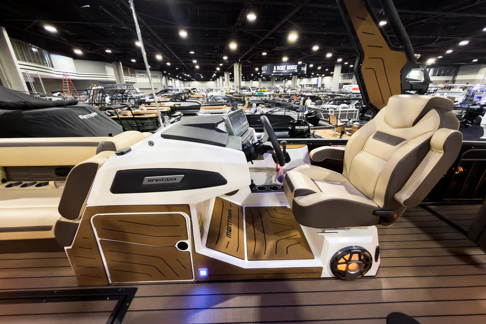 2026 Montara Surf Boss EVO SLDH 25' boat interior with luxurious captain's chair and control panel.