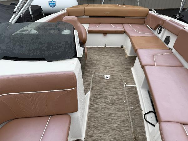 2017 Glastron 205 boat interior with brown seating and spacious layout.