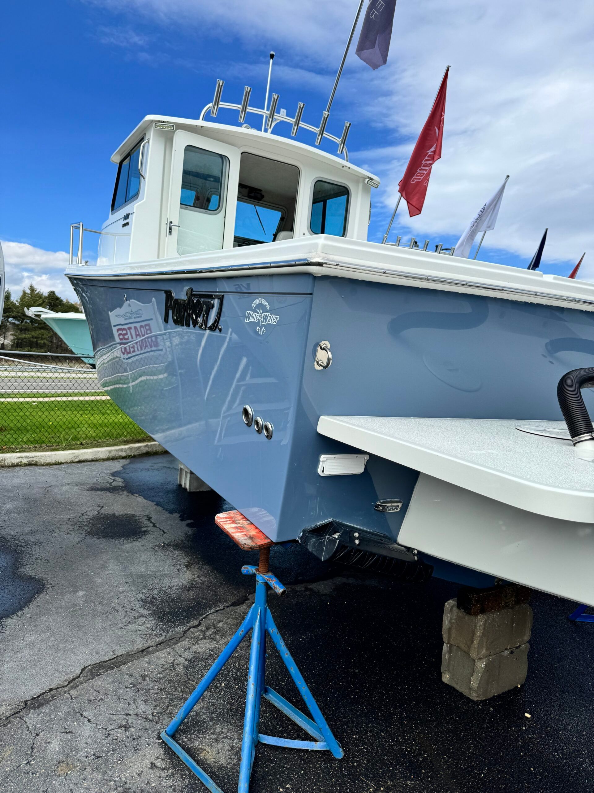 A 2021 Regal 26 Express boat is on a stand on land.