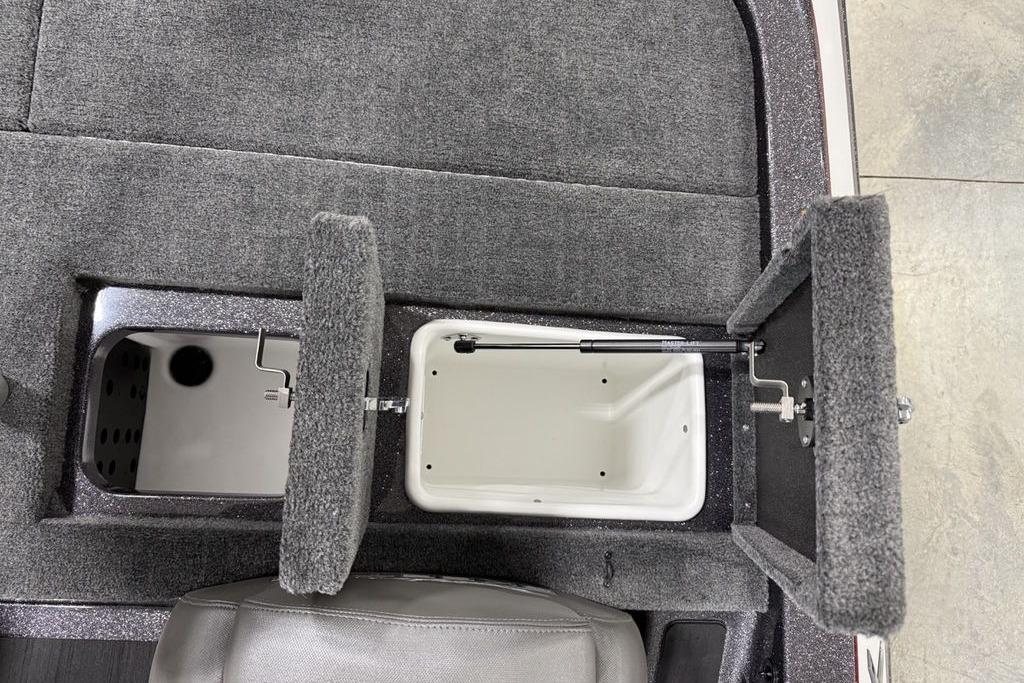 2025 Skeeter ZX150 boat storage compartments with open lids, showcasing interior design.
