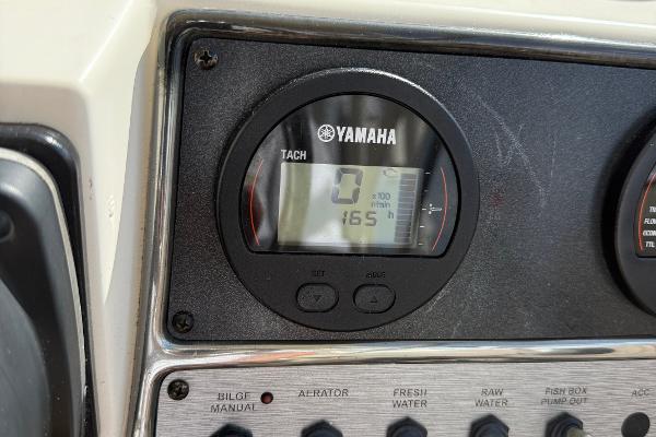 Yamaha tachometer on 2016 Scout 245 Dorado boat dashboard, displaying 165 hours.