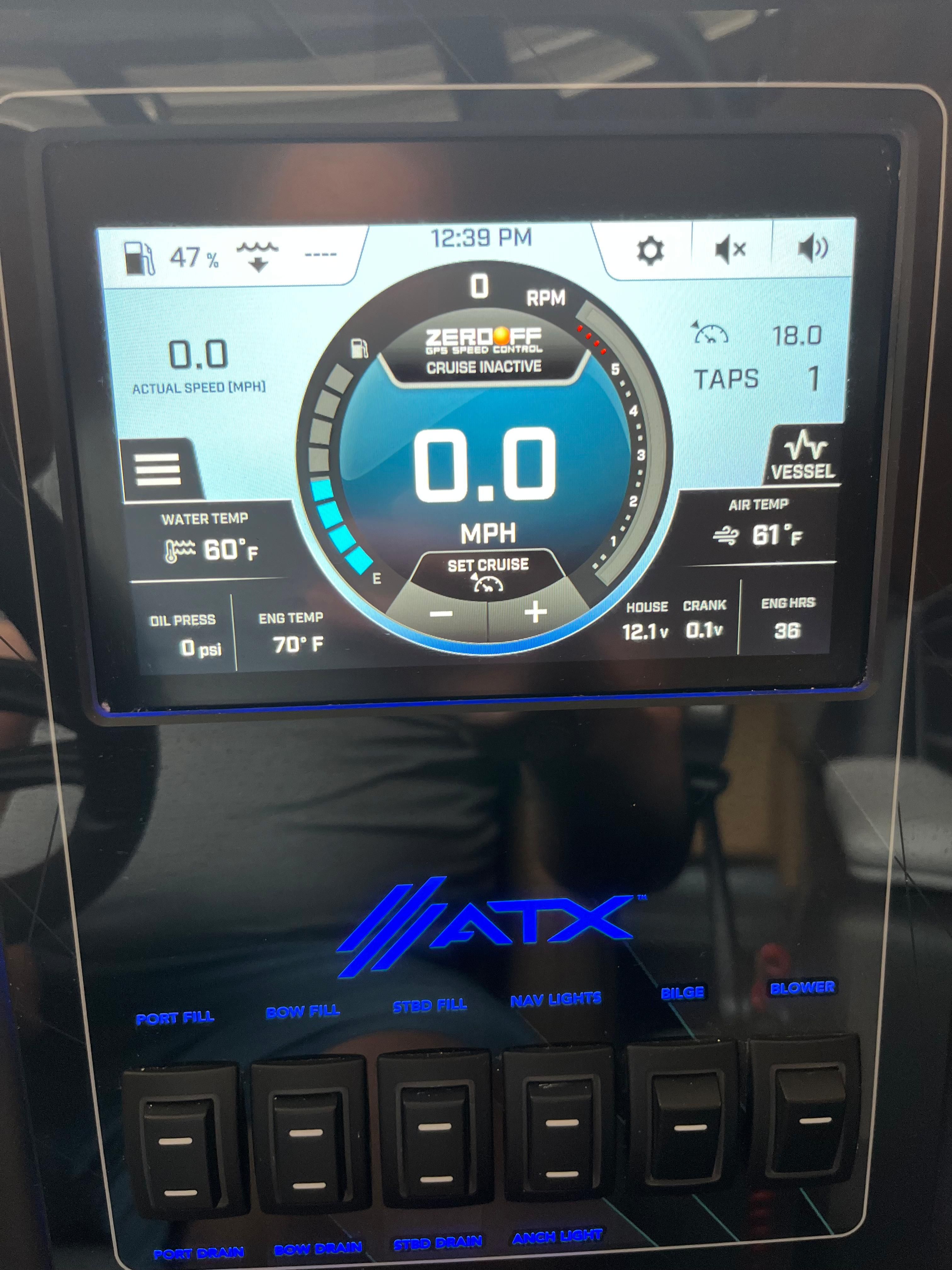 Dashboard of an ATX Surf Boats 22 Type-S with digital display and control switches.