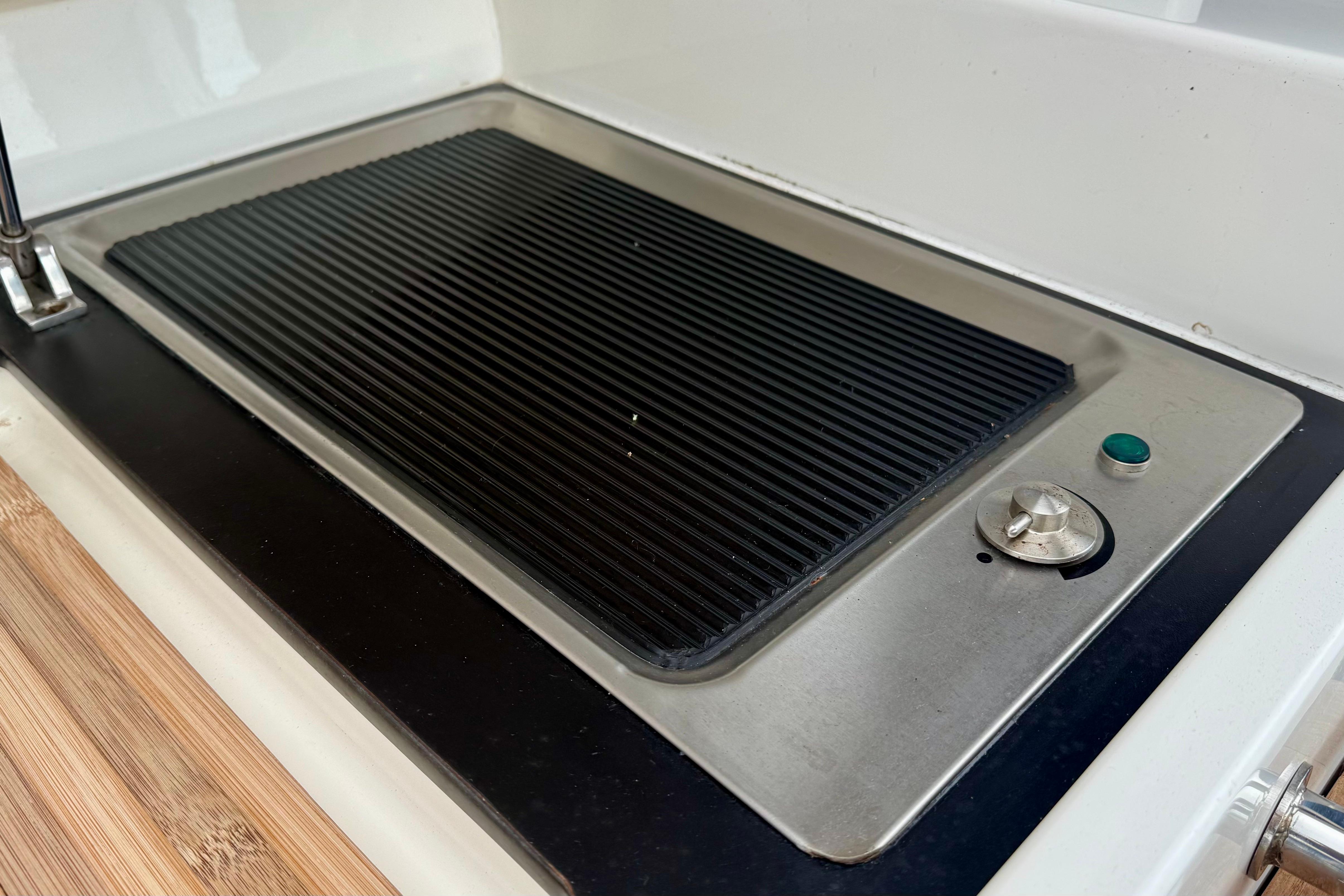 Built-in grill on 2012 Sealine SC42 yacht kitchen counter.