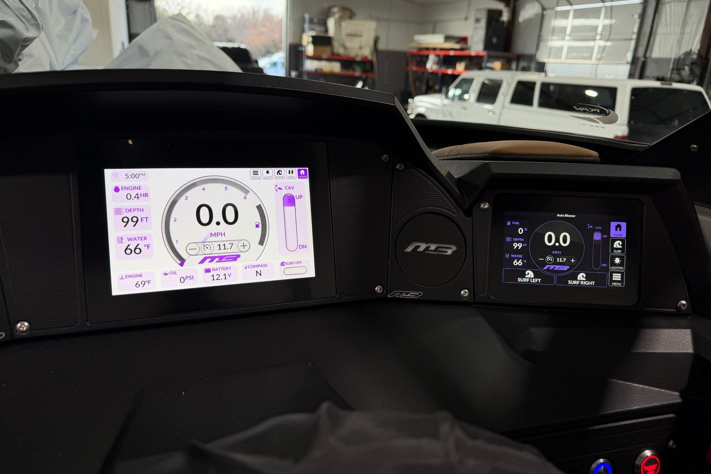 Dashboard of 2026 MB B52 21 Alpha boat with digital displays and controls.