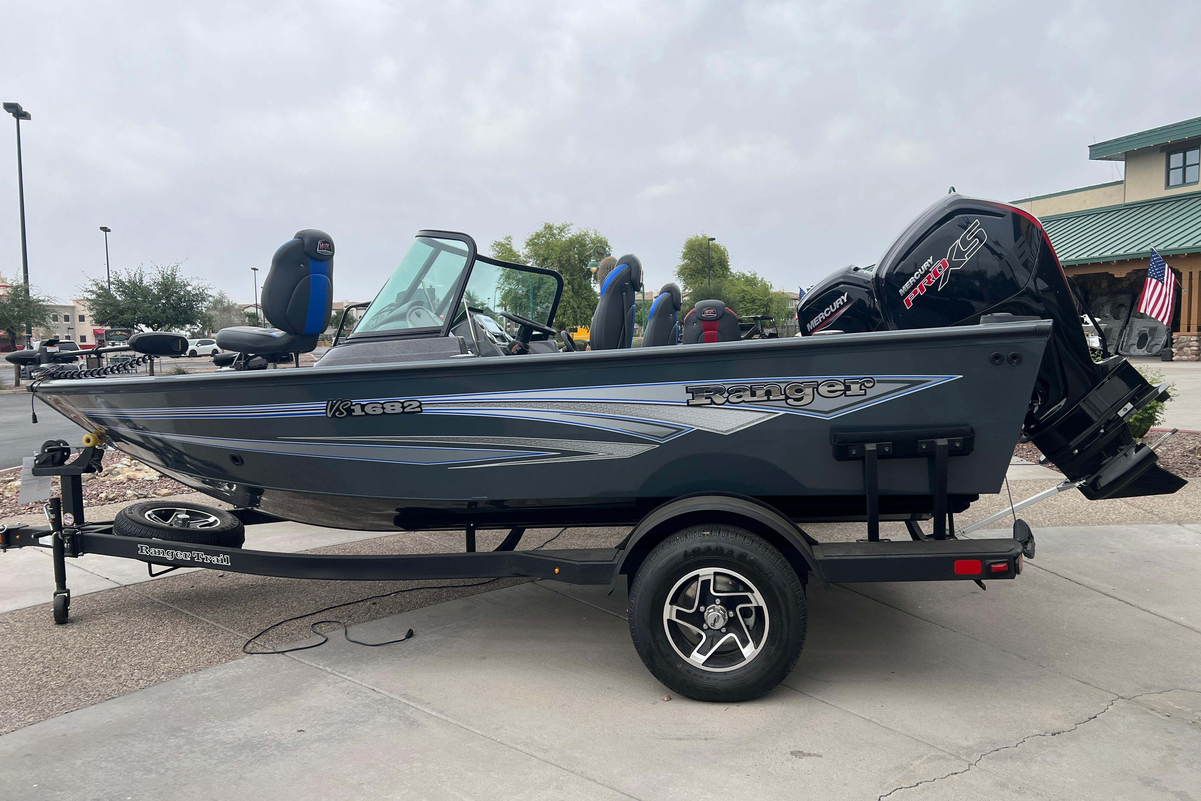 2026 Ranger VS1682SC Angler boat on trailer, parked outdoors.