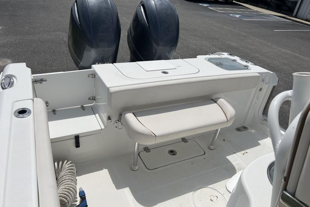 2021 Sea Hunt Gamefish 25 boat interior with dual engines and seating area.