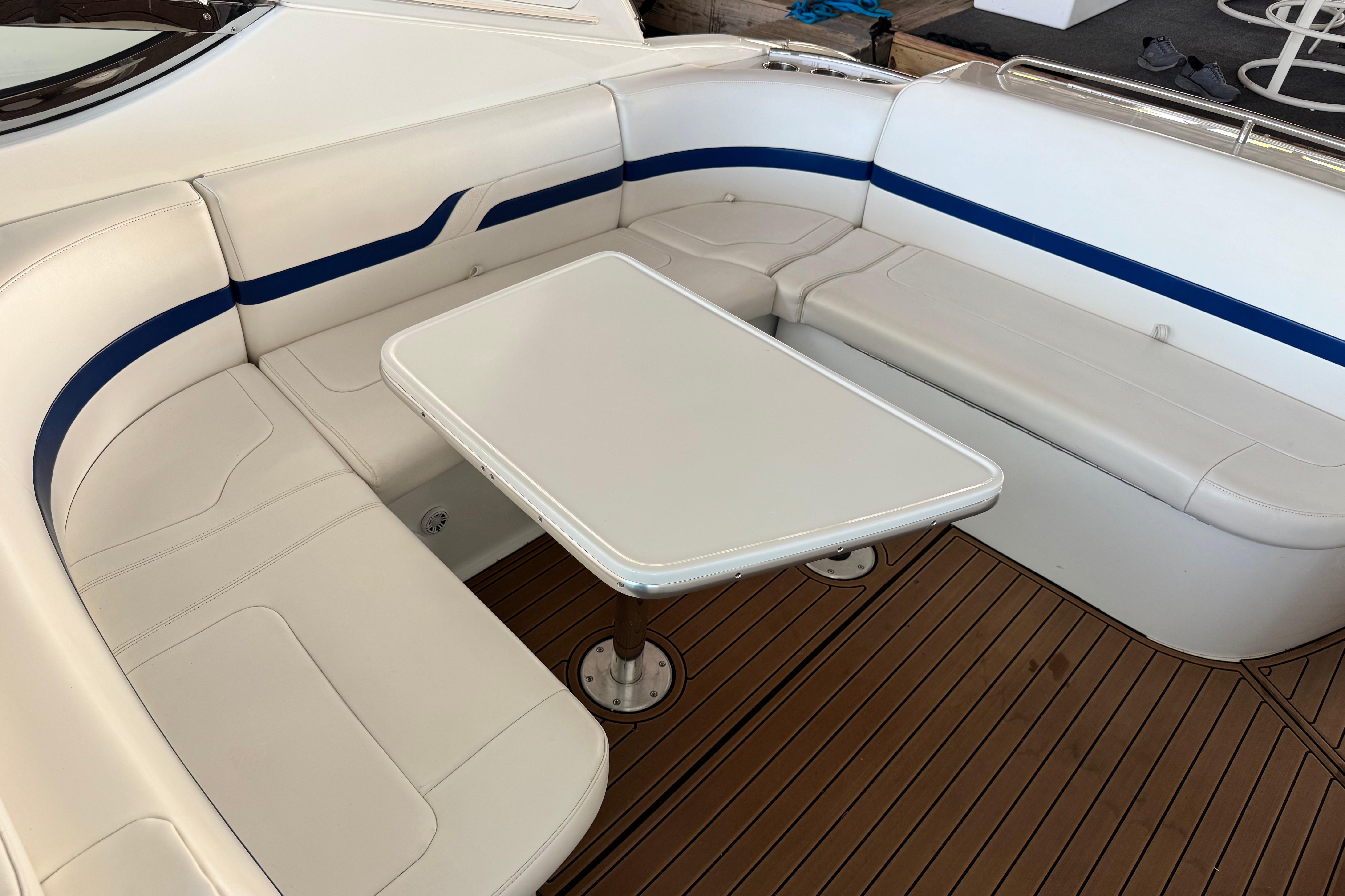 2008 Formula 400 Super Sport boat interior with white seating and wooden deck.