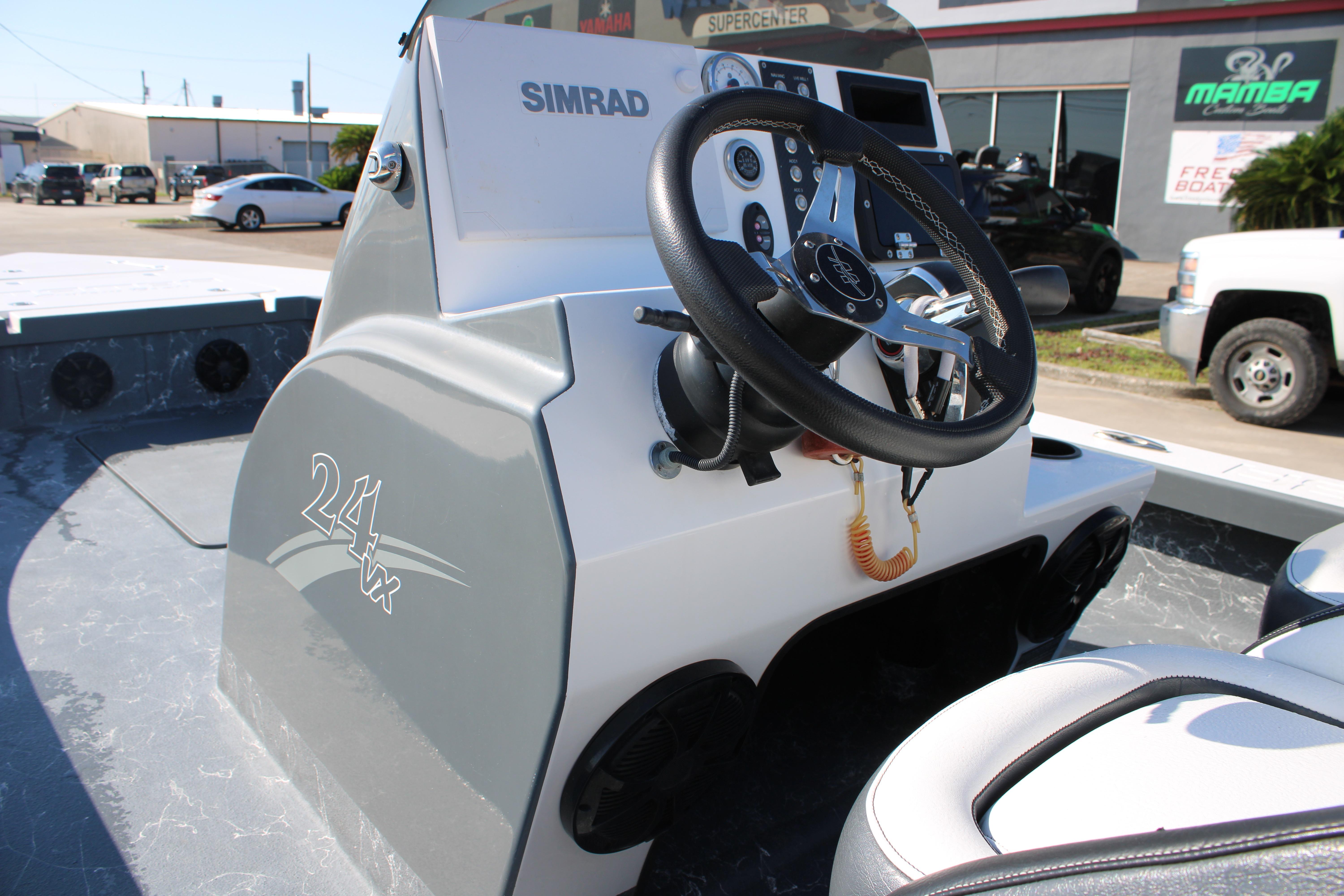 2023 Mamba 24VX boat dashboard with steering wheel and controls.