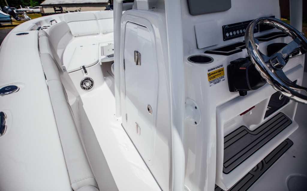 2021 Sea Fox 248 Commander boat interior with steering wheel and seating area.