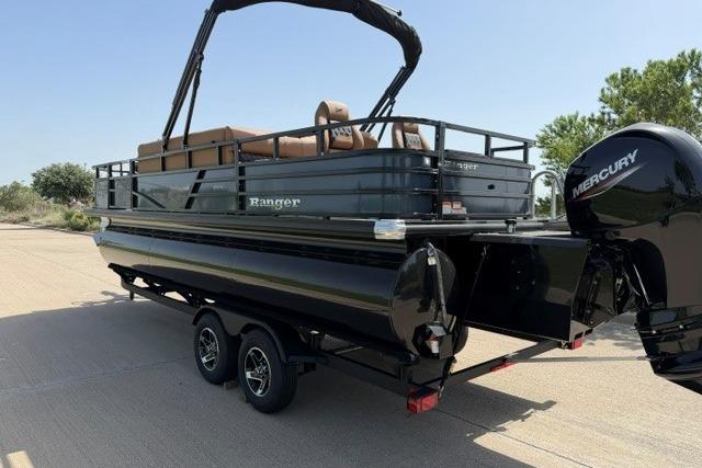 2026 Ranger 223F pontoon boat with Mercury engine on a trailer, parked outdoors.