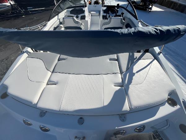 2024 Tahoe 210 Si boat with white leather seating and sunshade.