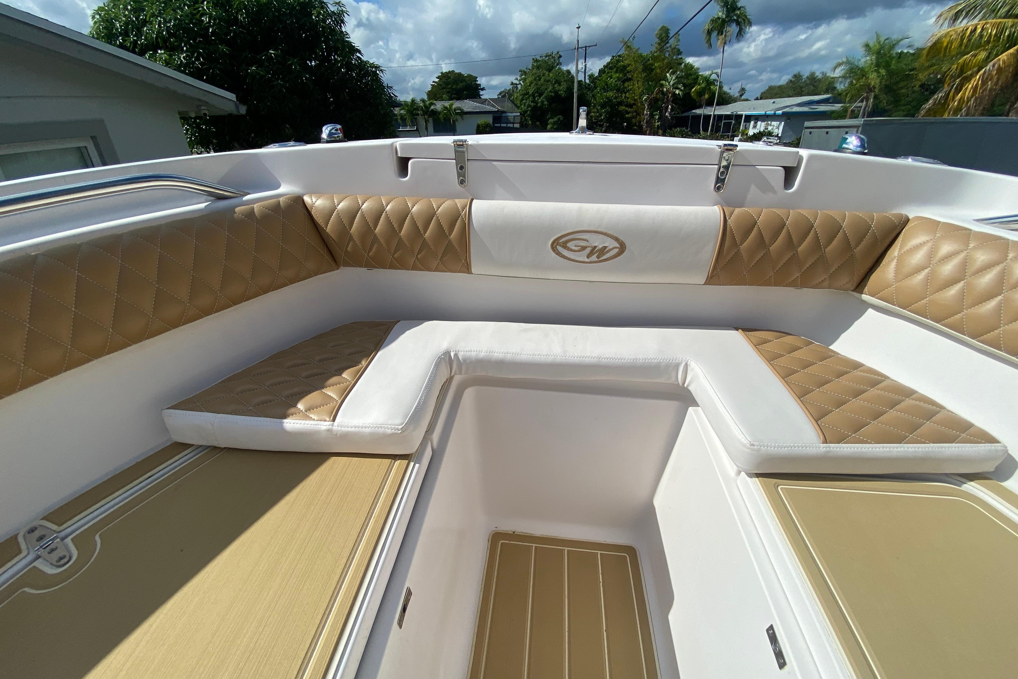2004 Grady-White Canyon 283 boat interior with tan diamond-stitched seating.