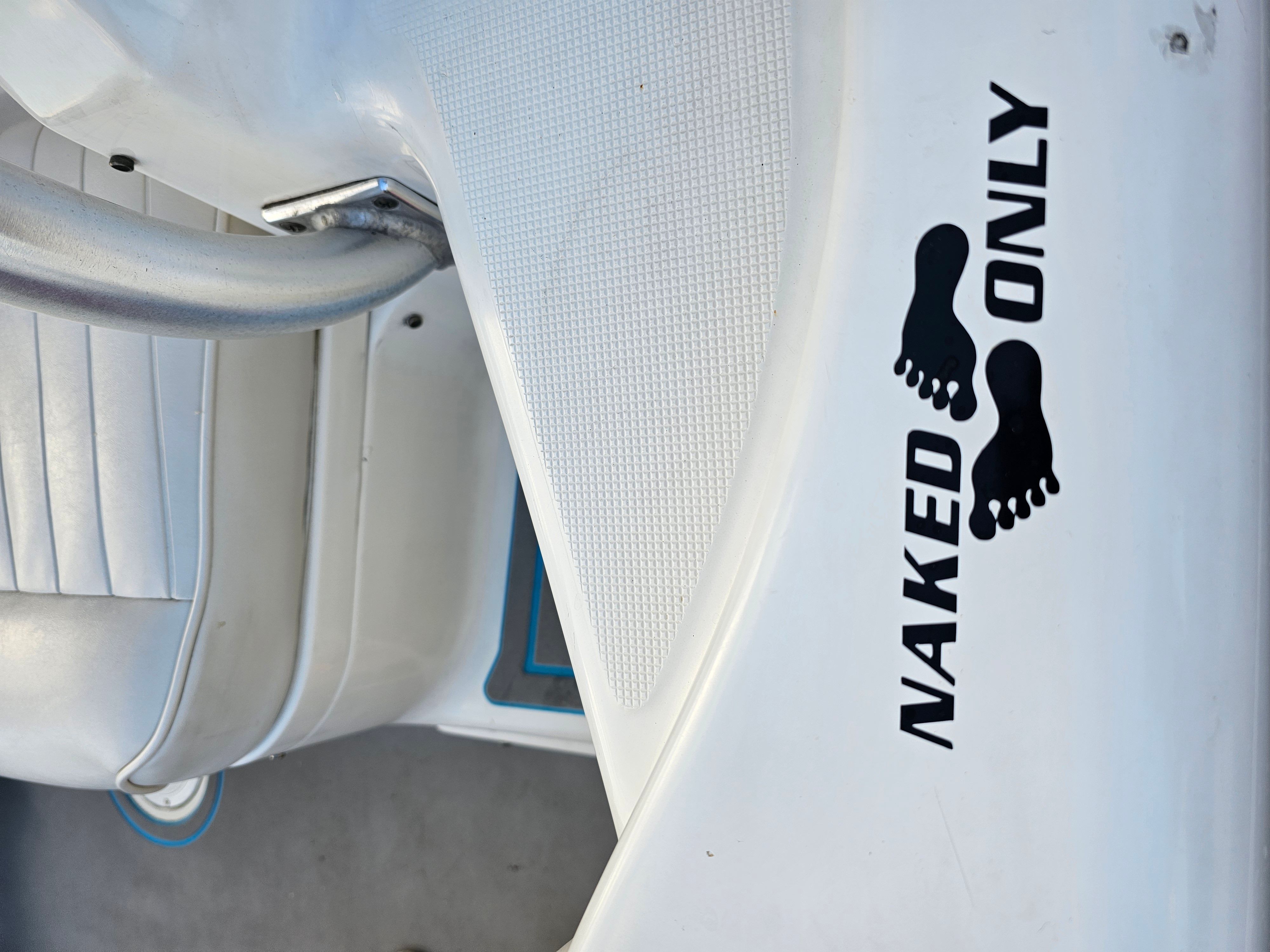2005 Robalo R265 Walkaround with "Naked Only" sticker.