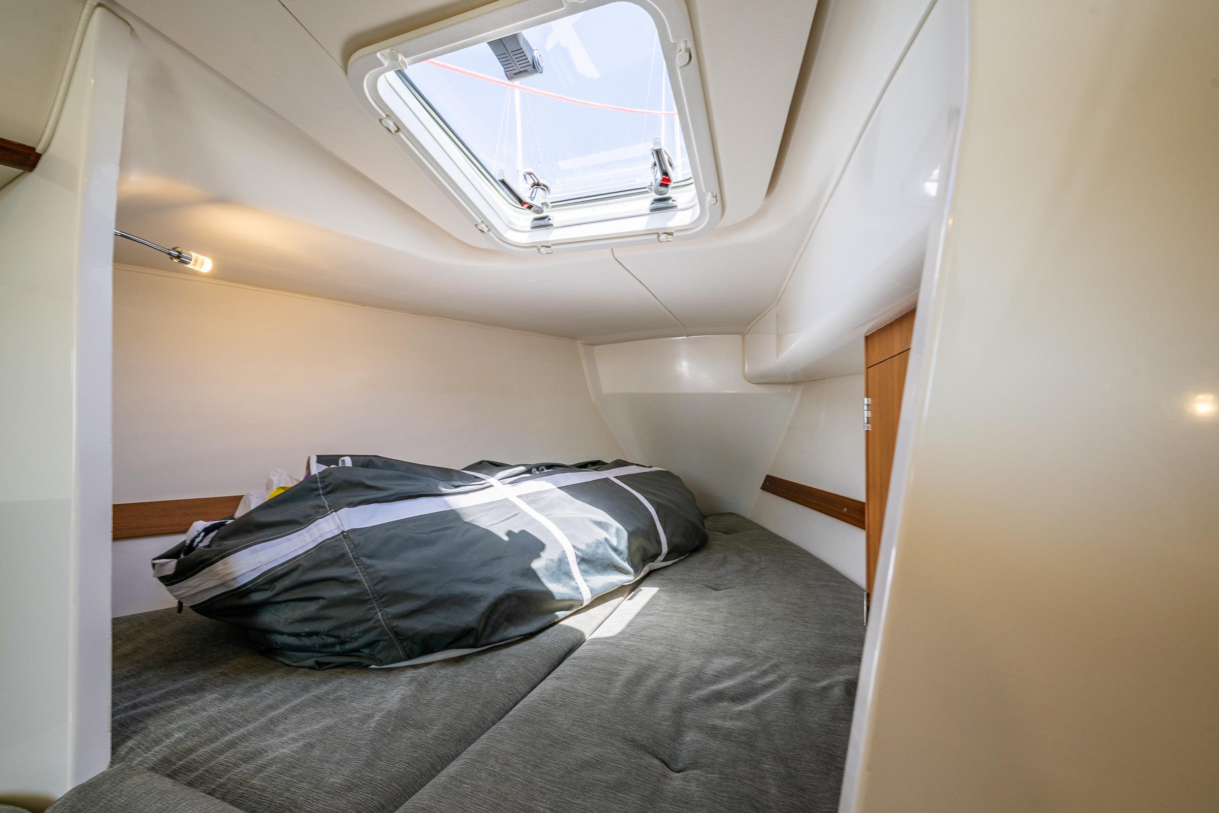 Cozy cabin interior of 2018 J Boats J/97E sailboat with overhead hatch.