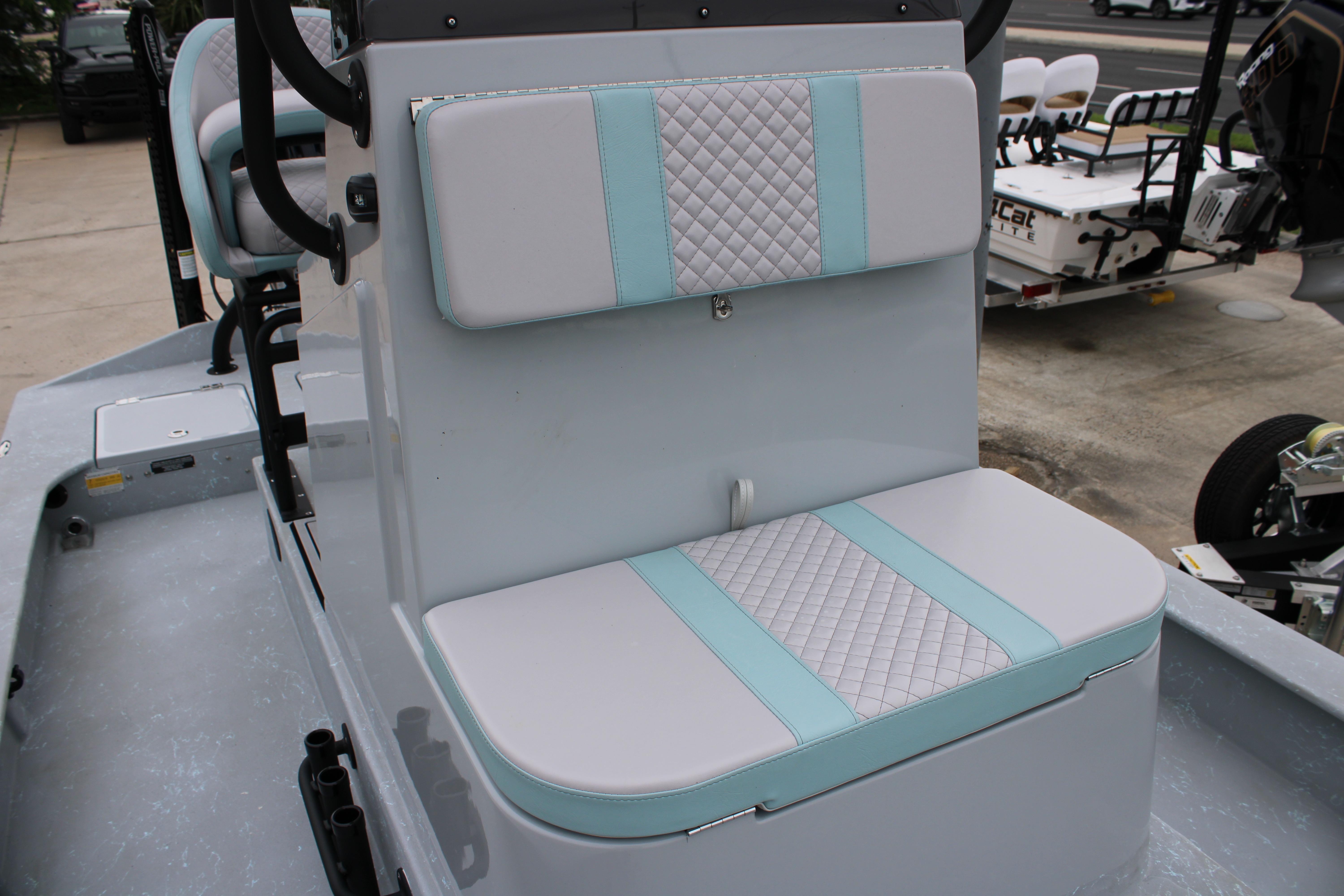 2026 Freedom Boats 24 Defender interior seating with quilted design and light blue accents.
