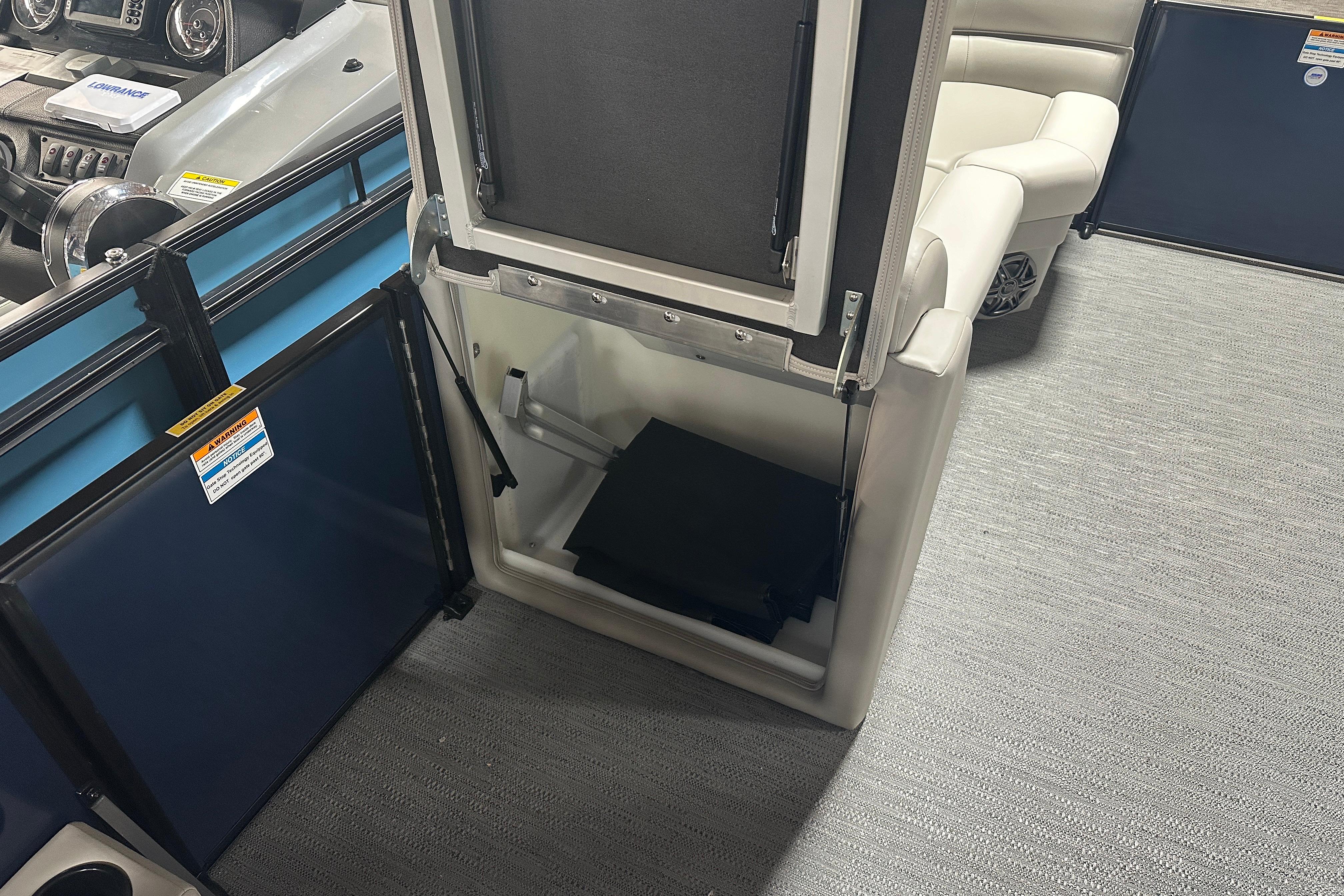 2026 Godfrey Xperience 2286 SBX boat interior with open storage compartment and seating.