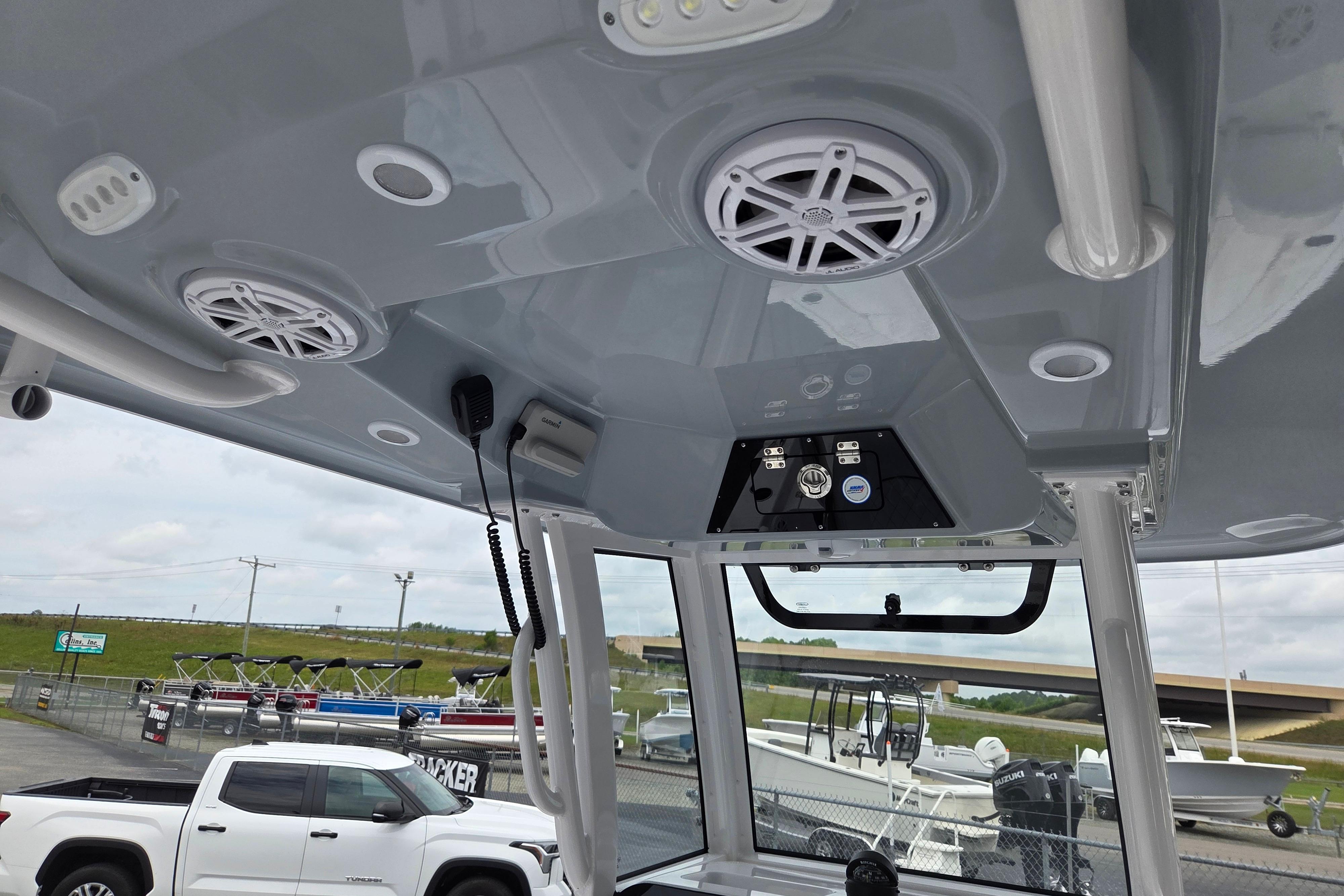2026 Sportsman Masters 247 Bay Boat interior with speakers and control panel.