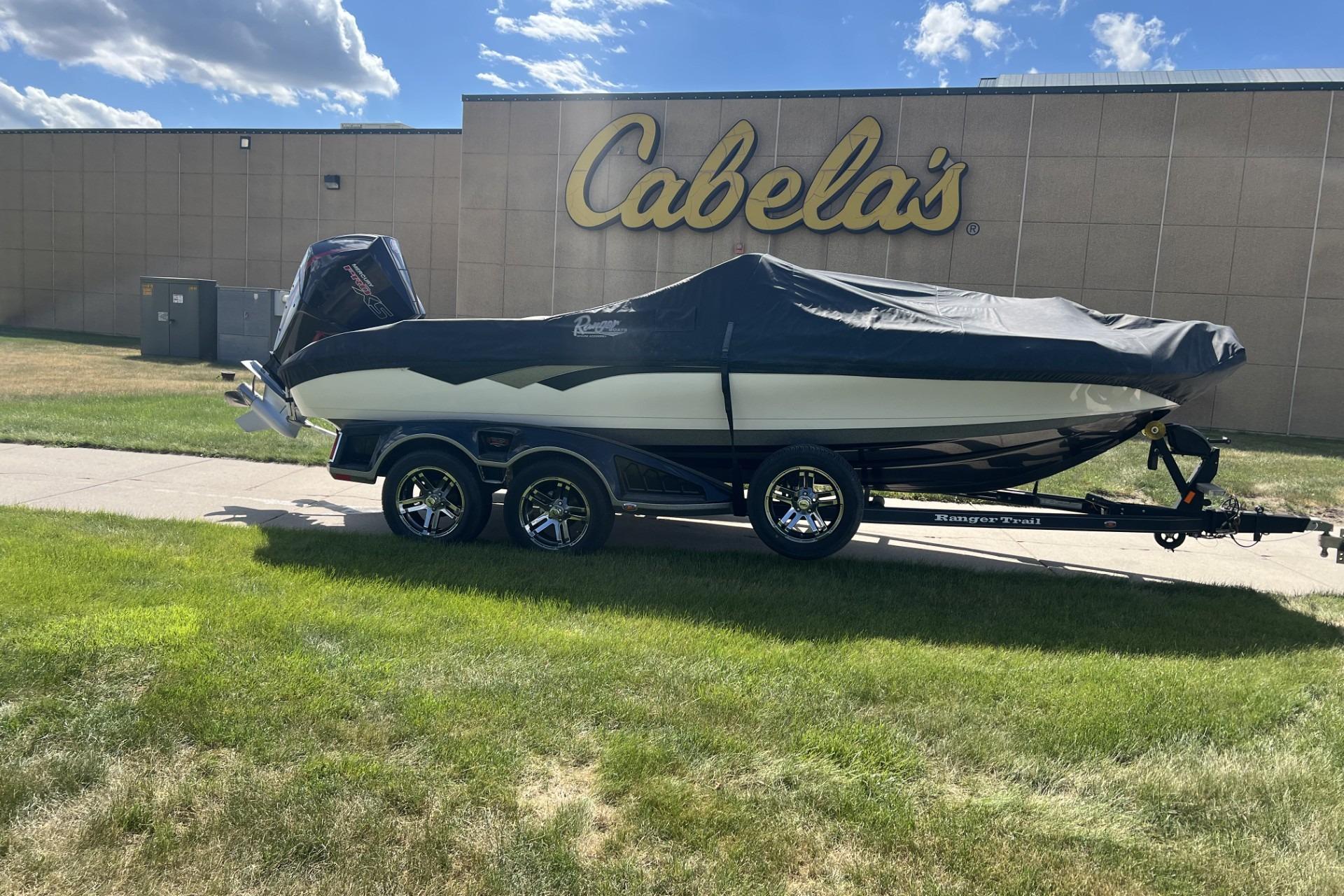2023 Ranger 620FS Cup-Equipped boat on trailer outside Cabela's store.
