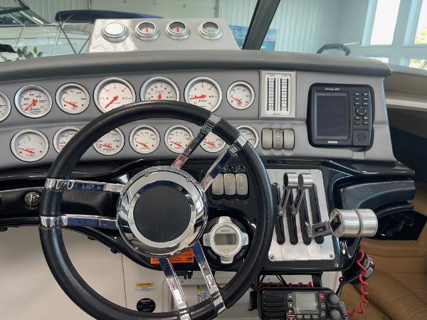 Dashboard of a 2005 Cobalt 343 boat with gauges and controls.
