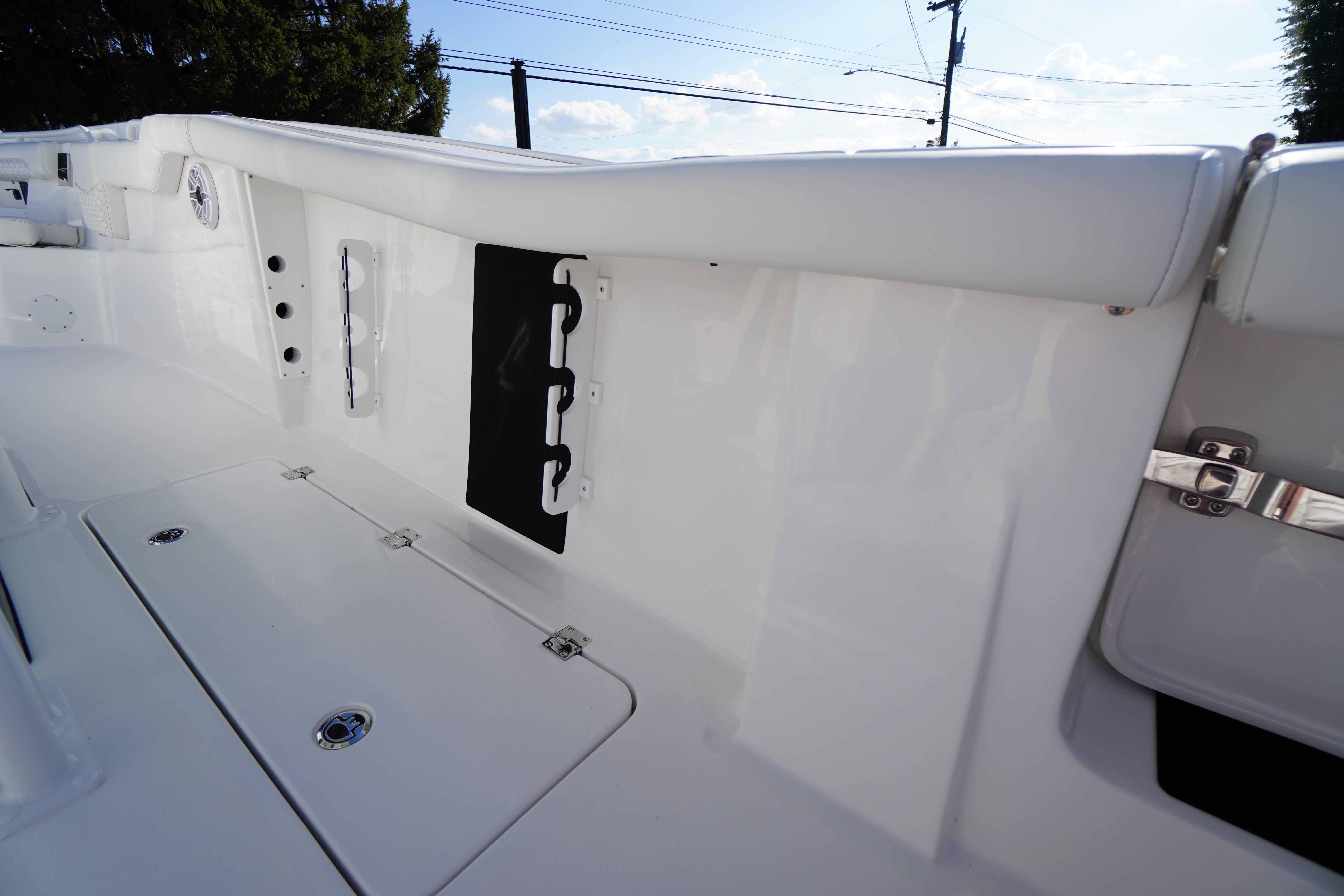 2026 Tidewater 272 LXF boat interior, featuring sleek white design and storage compartments.
