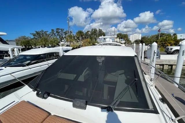 2016 Sea Ray Sundancer 510 yacht docked under a clear blue sky.