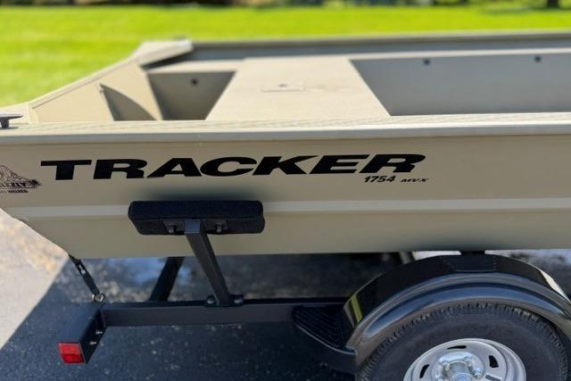 2026 Tracker Grizzly 1754 Utility boat on trailer, side view.