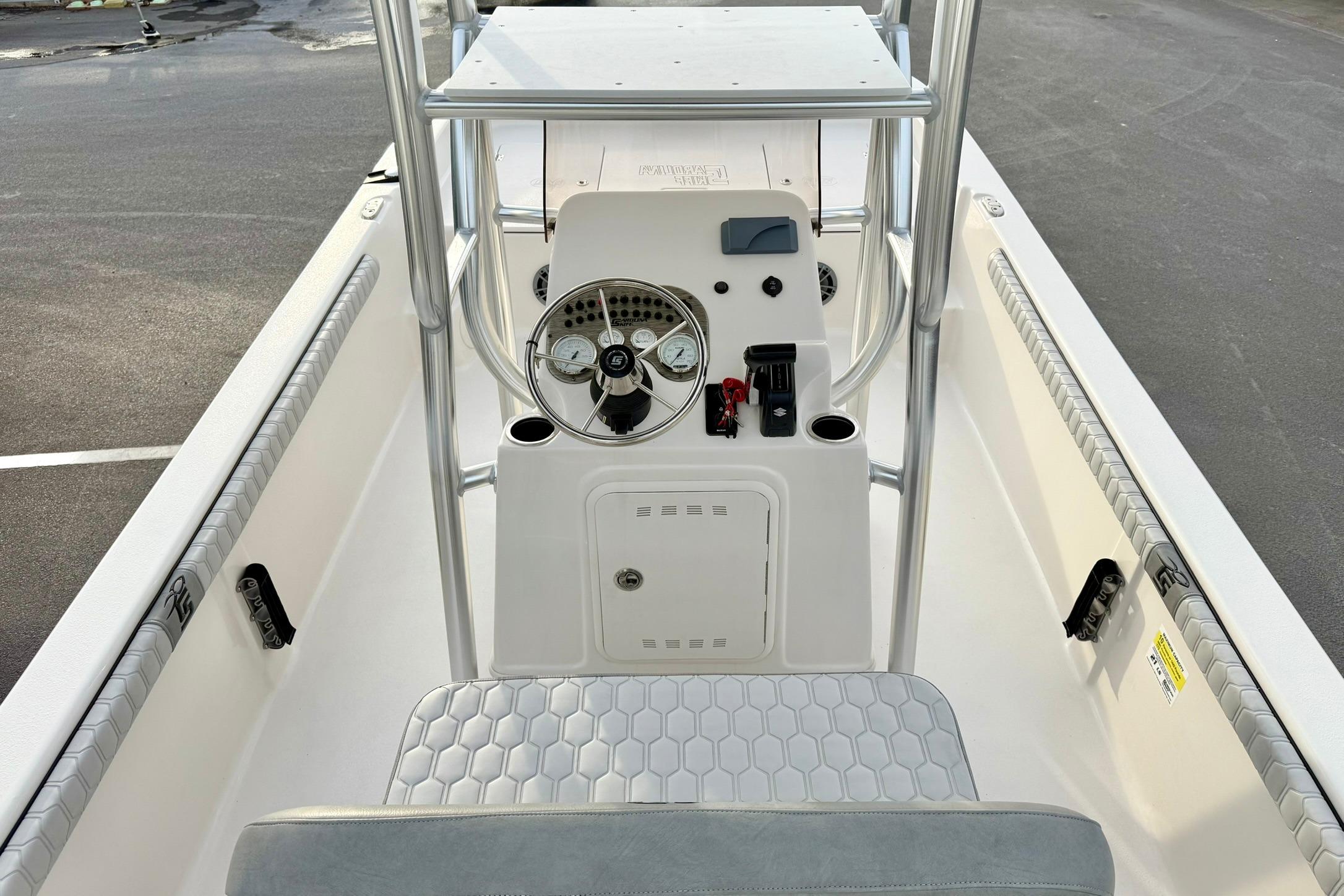 2025 Carolina Skiff 21 LS boat interior with steering console and seating.