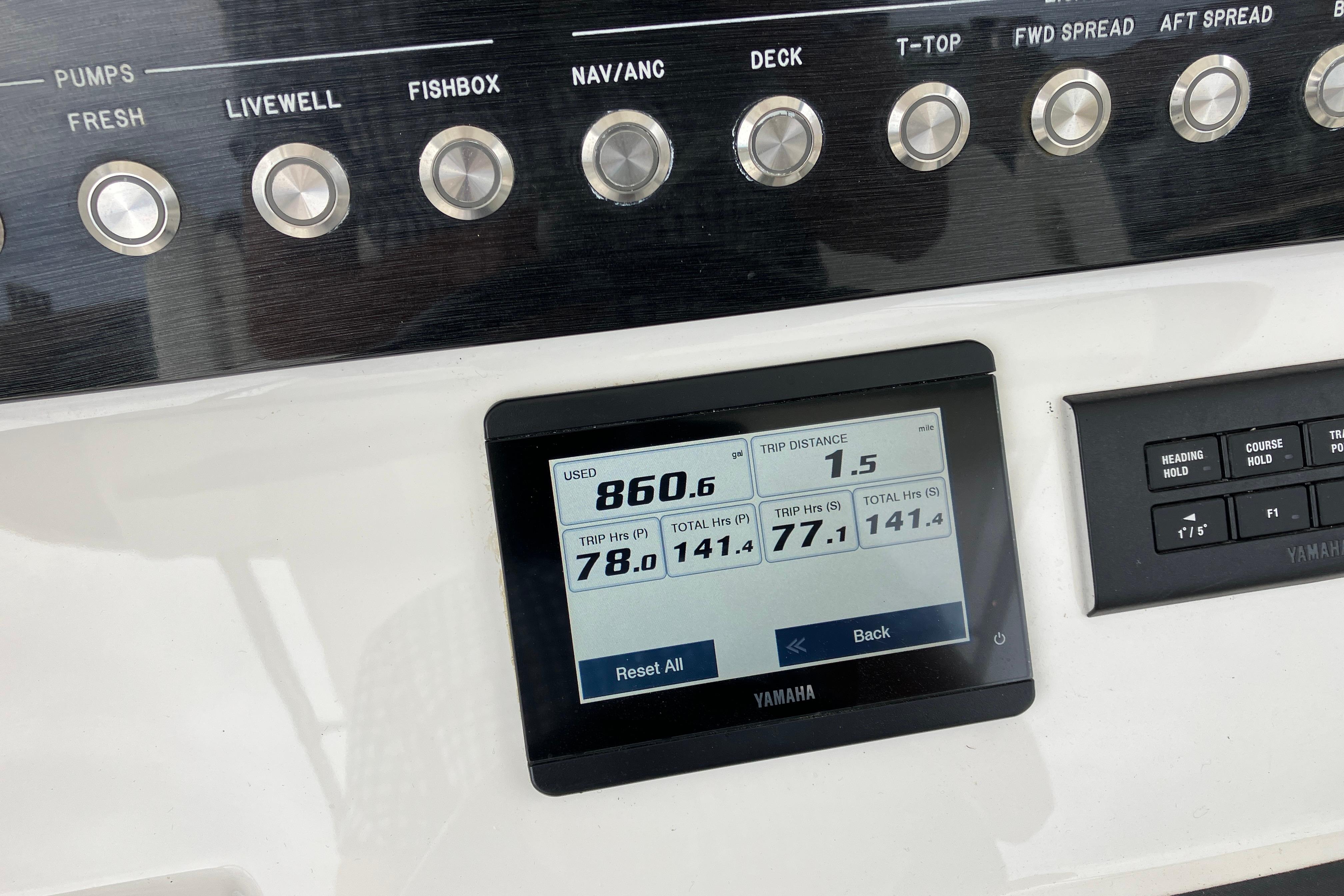 Control panel of a 2021 Regulator 31 boat with Yamaha display showing trip data.