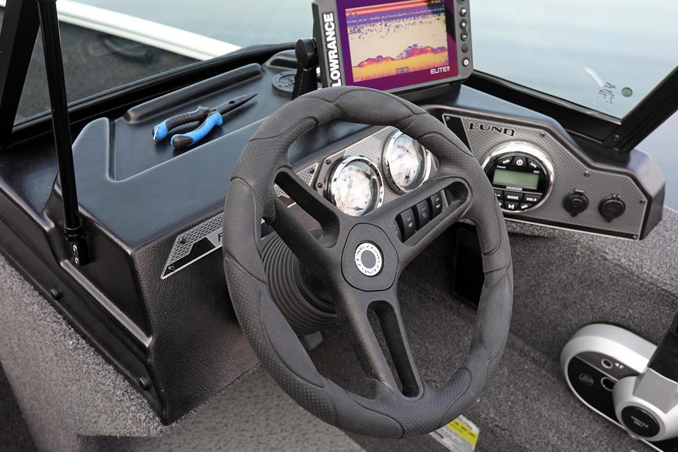 Manufacturer Provided Image: 2025 Lund 1650 Rebel XL Sport boat dashboard with steering wheel and navigation system.
