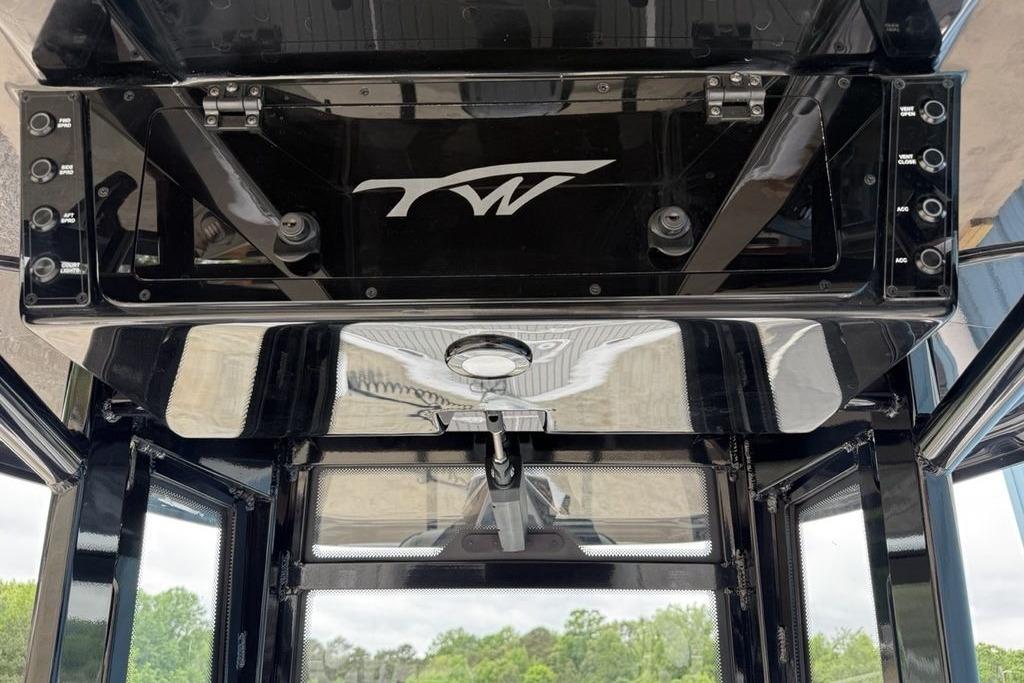 Overhead console of 2026 Tidewater 2500 Carolina Bay boat with control switches.