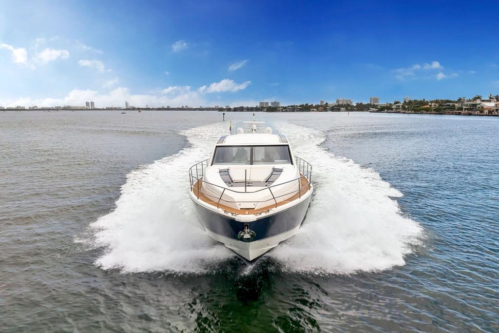 2012 Fairline Targa 58 yacht cruising on open water under a clear blue sky.