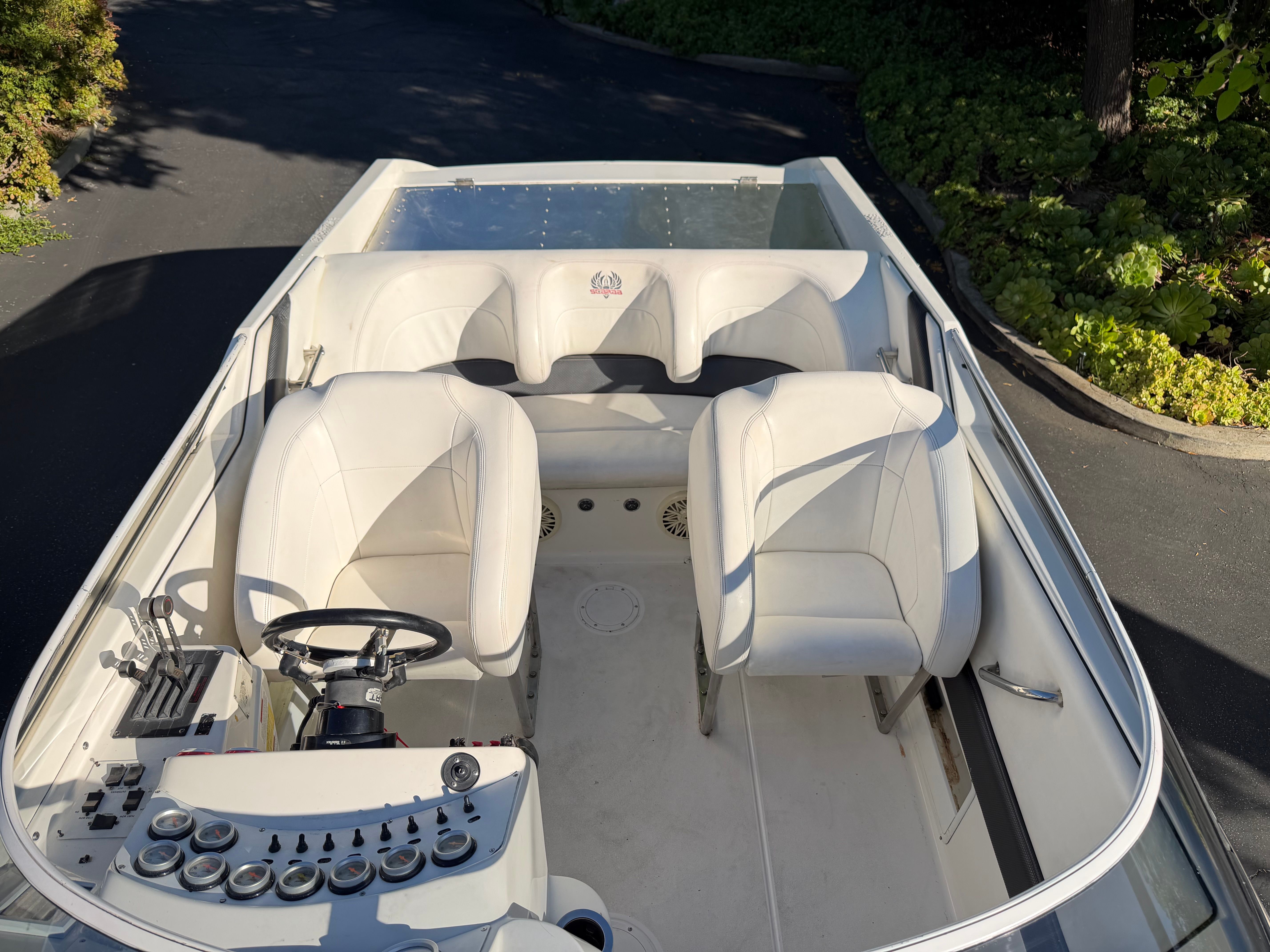 Interior of a 1997 Wellcraft 29 Scarab with white seats.