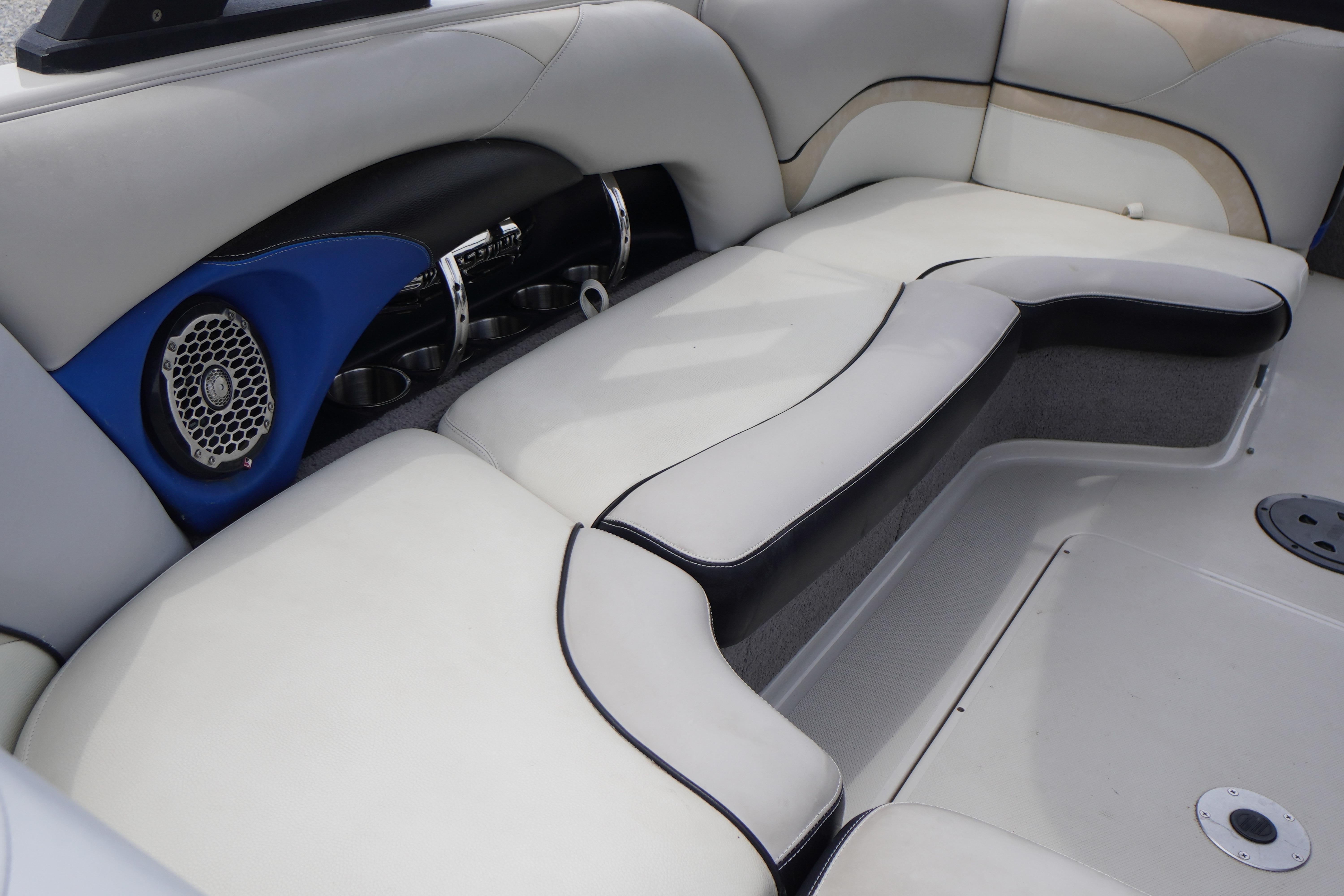 2011 Malibu Wakesetter 21 VLX interior with cushioned seating and built-in speaker system.