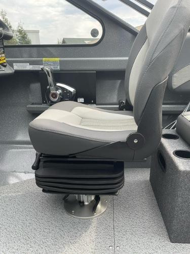 2025 Spartan 200 Astoria boat interior with a modern captain's seat and control panel.