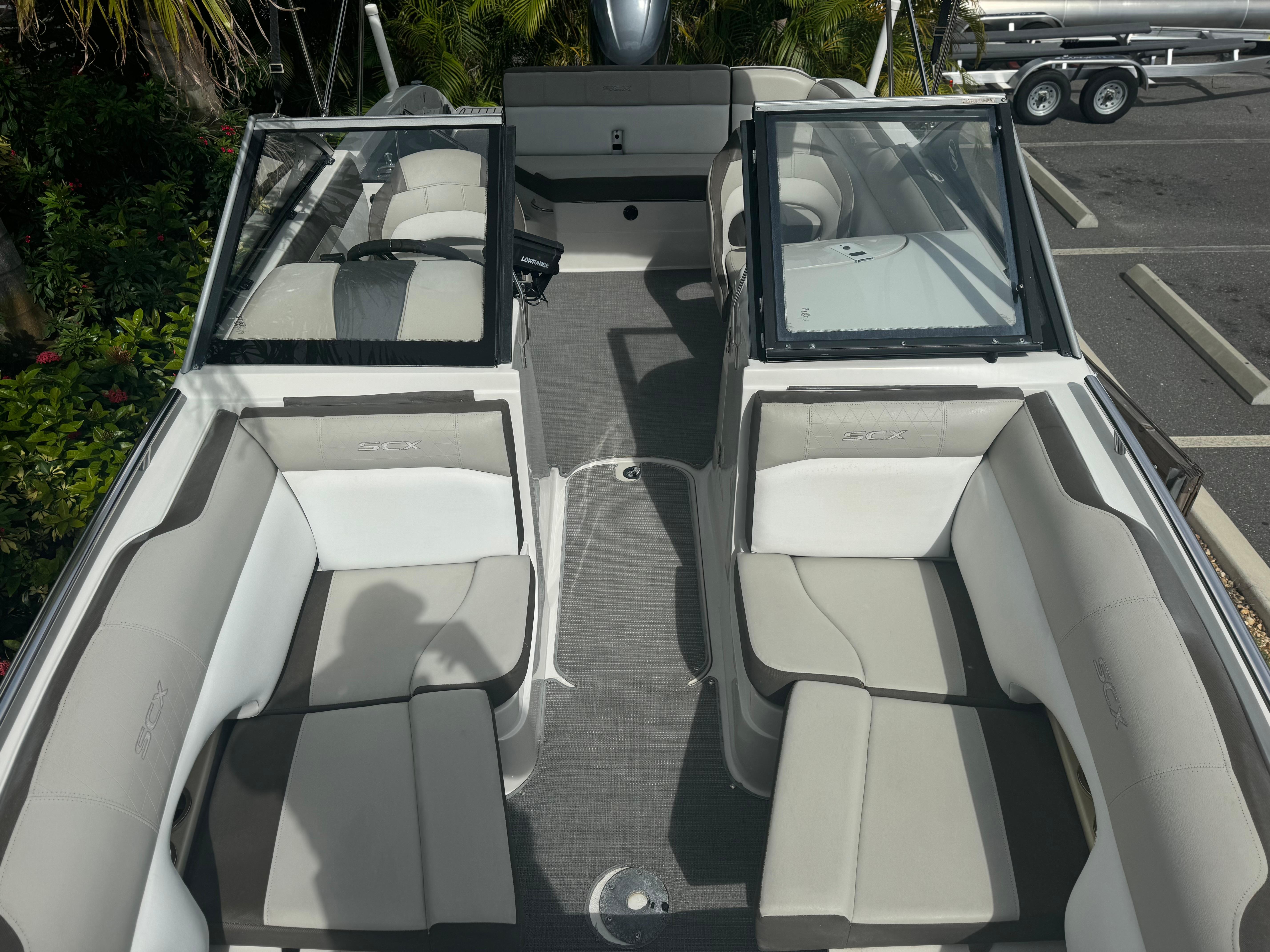 2017 Starcraft 230 OB SCX EXT boat interior with gray and white seating, open deck layout.