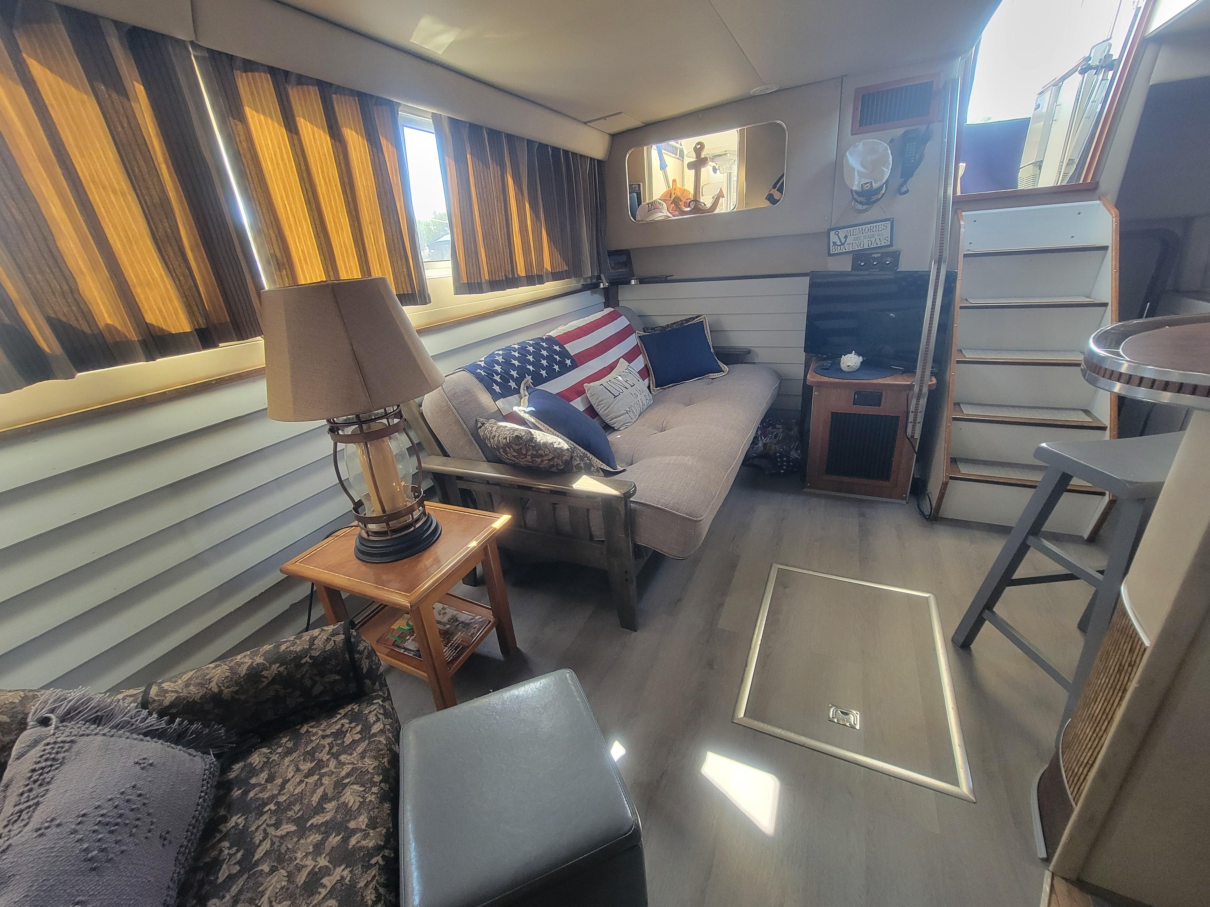 Interior of 1986 Chris-Craft 381 Catalina yacht with cozy seating and decor.