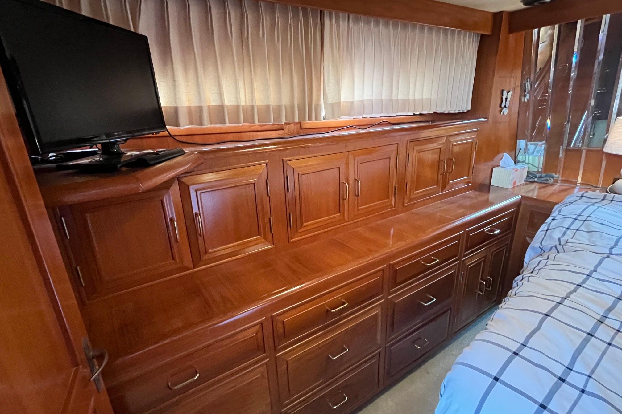 Luxurious wooden cabinetry in 1989 Ocean Alexander 440 Sundeck CPMY yacht interior.