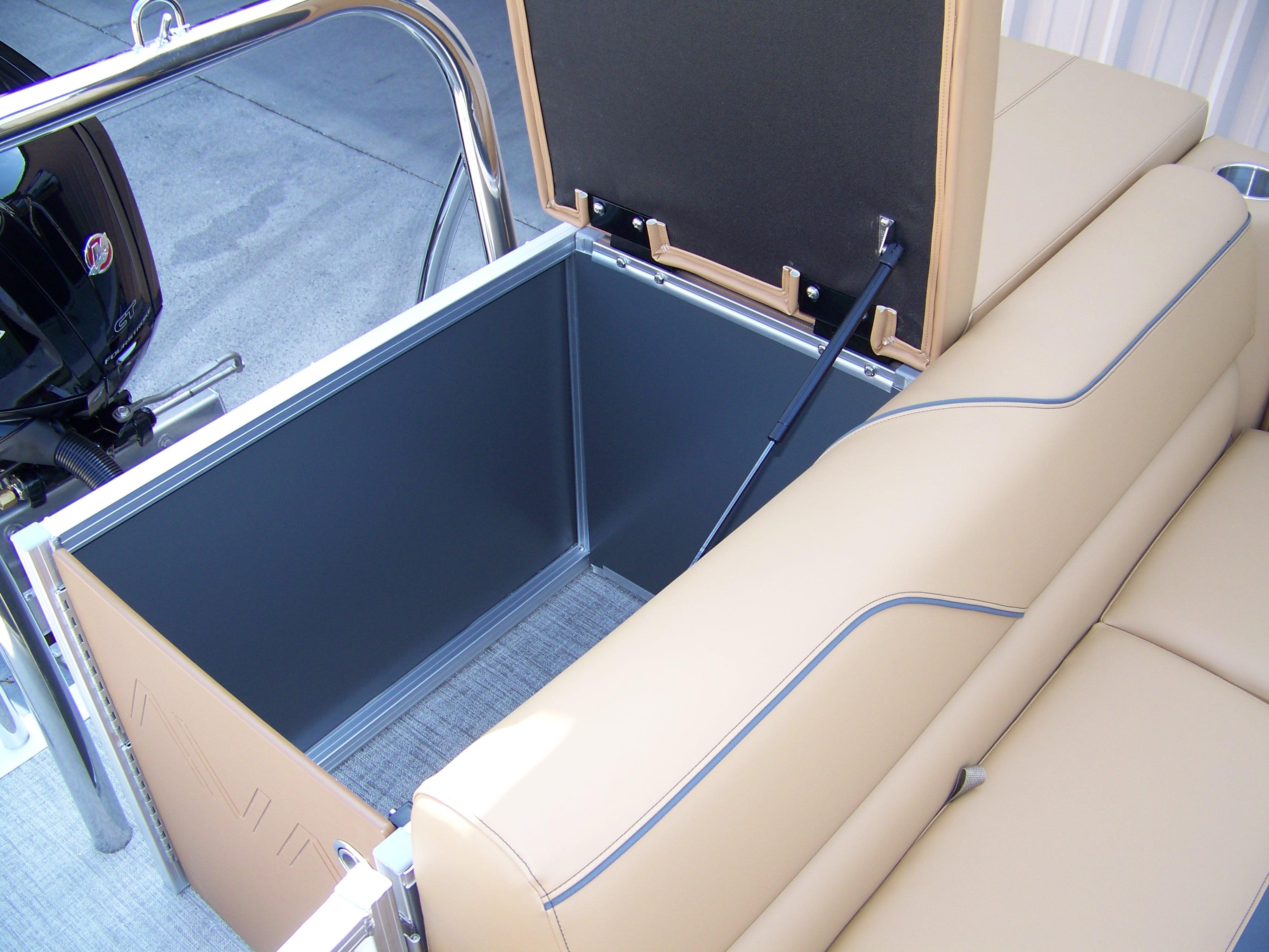 2025 Avalon VENTURE CRUISE boat with open storage compartment and beige seating.