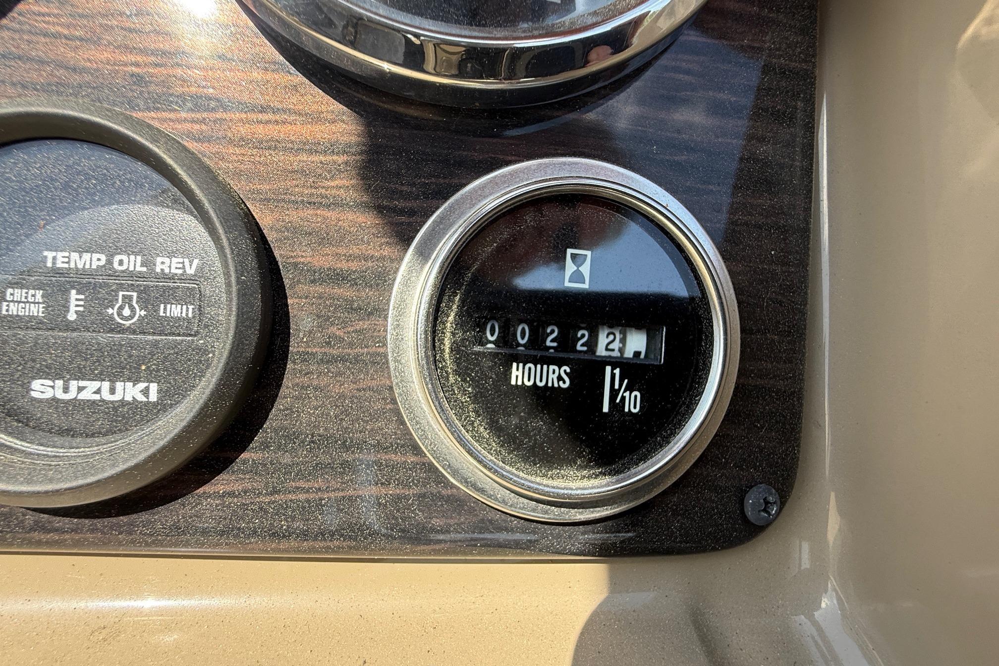 Dashboard of 2024 Sylvan X1 CLZ DH showing hour meter and Suzuki gauge.
